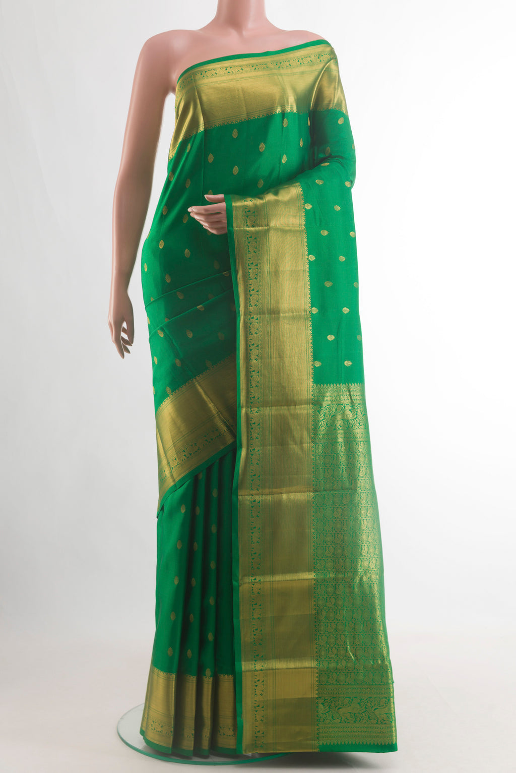 Pure Silk Green Kanchipuram Saree with Zari Butta on the body and Zari Border.  displayed on a mannequin