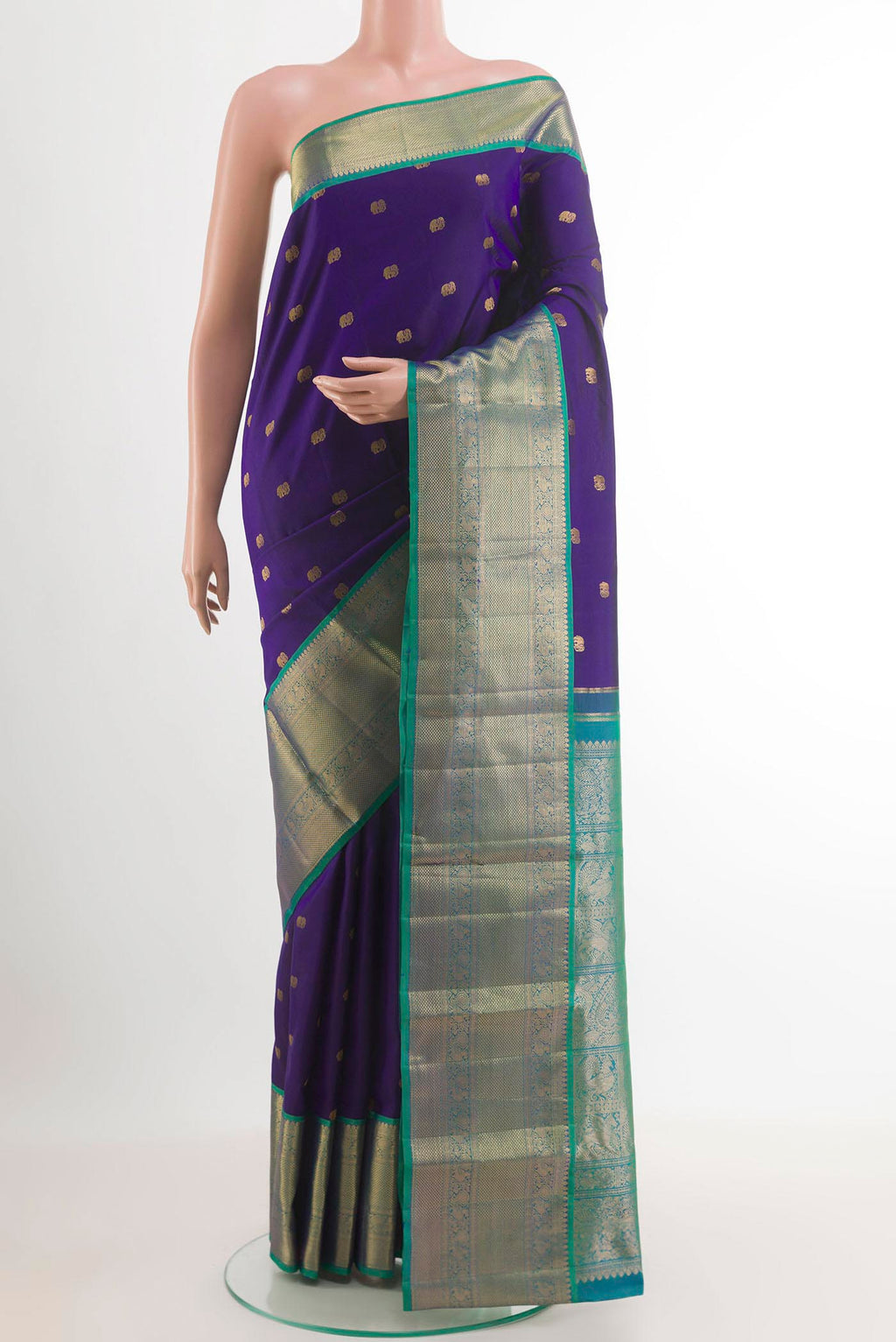 Blue Kanchipuram Silk Saree with Zari Butta on the body and Zari Border.  displayed on a mannequin
