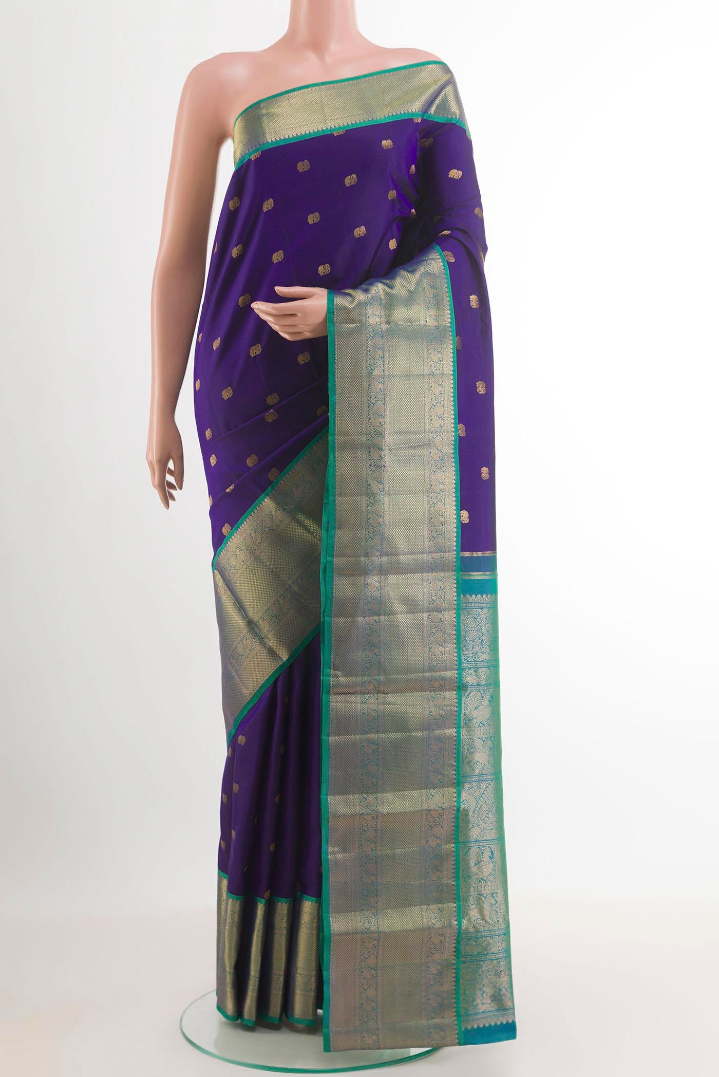Blue Kanchipuram Silk Saree with Zari Butta on the body and Zari Border.  displayed on a mannequin
