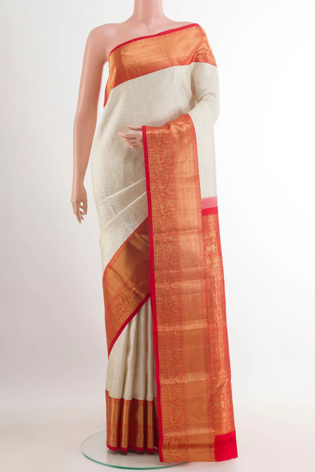 Off White Kanjivaram Silk Saree with Zari Brocade on the body and Zari Border.  displayed on a mannequin
