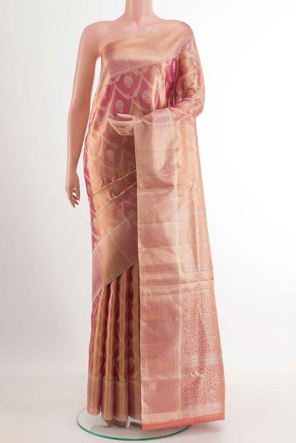Rose Gold Kanchipuram Tissue Silk Saree with Zari Brocade on the body and Zari Border.  displayed on a mannequin