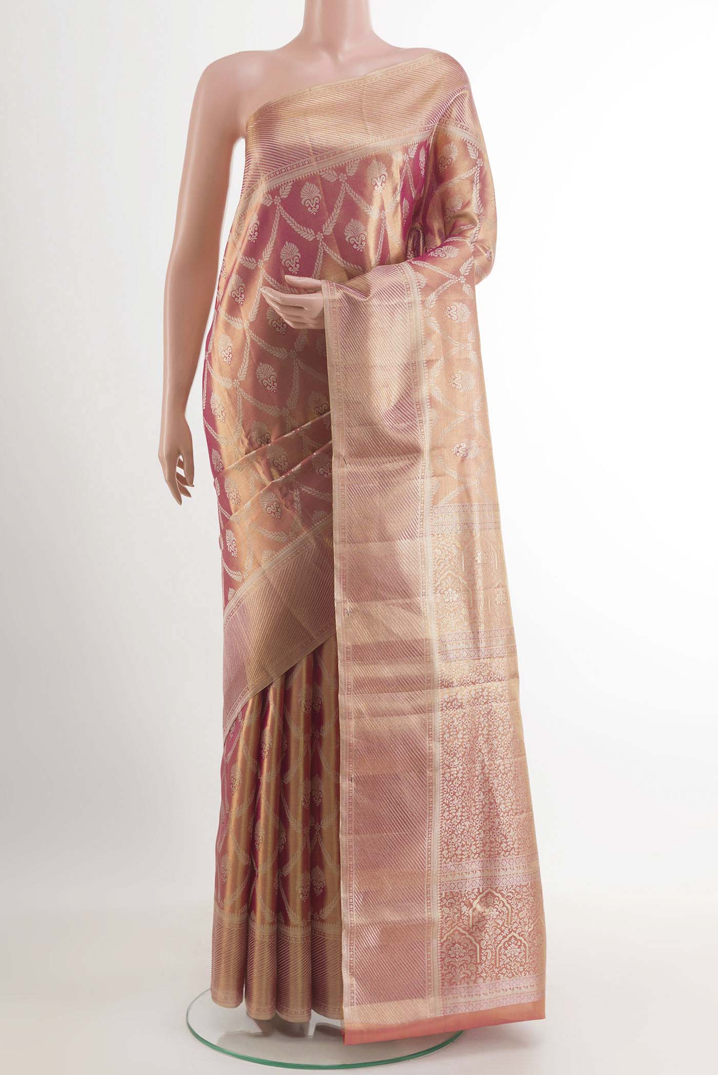 Rose Gold Kanchipuram Tissue Silk Saree with Zari Brocade on the body and Zari Border.  displayed on a mannequin