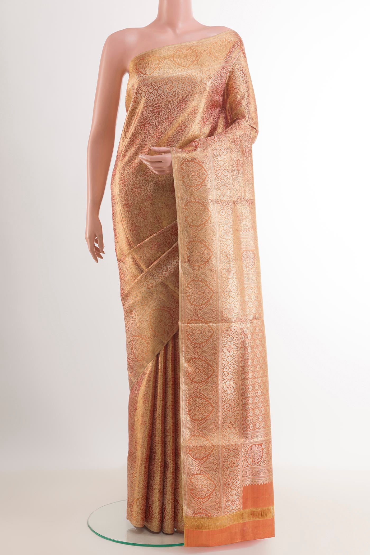 Golden Peach Kanchipuram Tissue Silk Saree with Zari Brocade on the body and Zari Border.  displayed on a mannequin