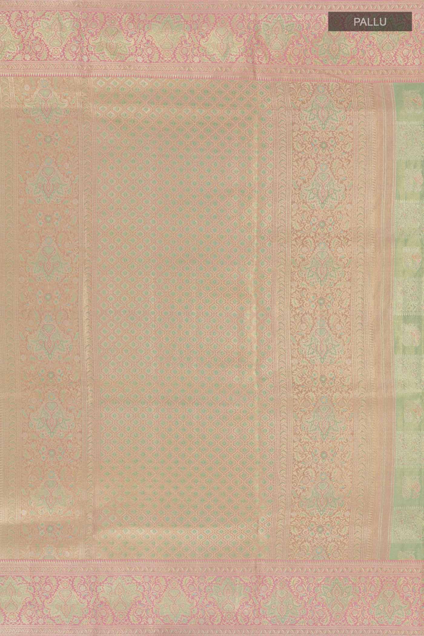 Close up image of the pallu of Green Kanjivaram Tissue Silk Saree with Zari Brocade on the body and Zari Border. 