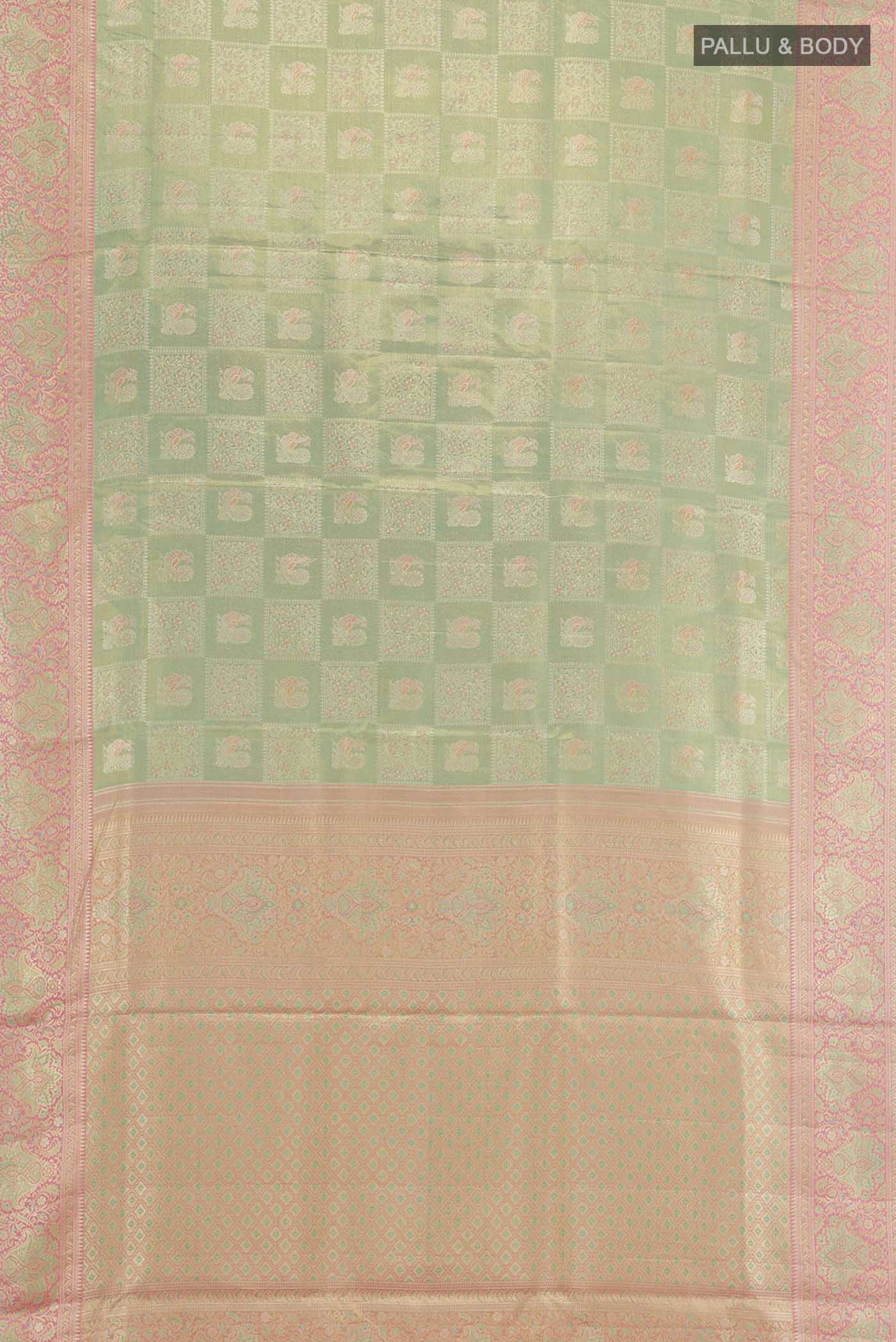 Flat view of Green Kanjivaram Tissue Silk Saree with Zari Brocade on the body and Zari Border. 