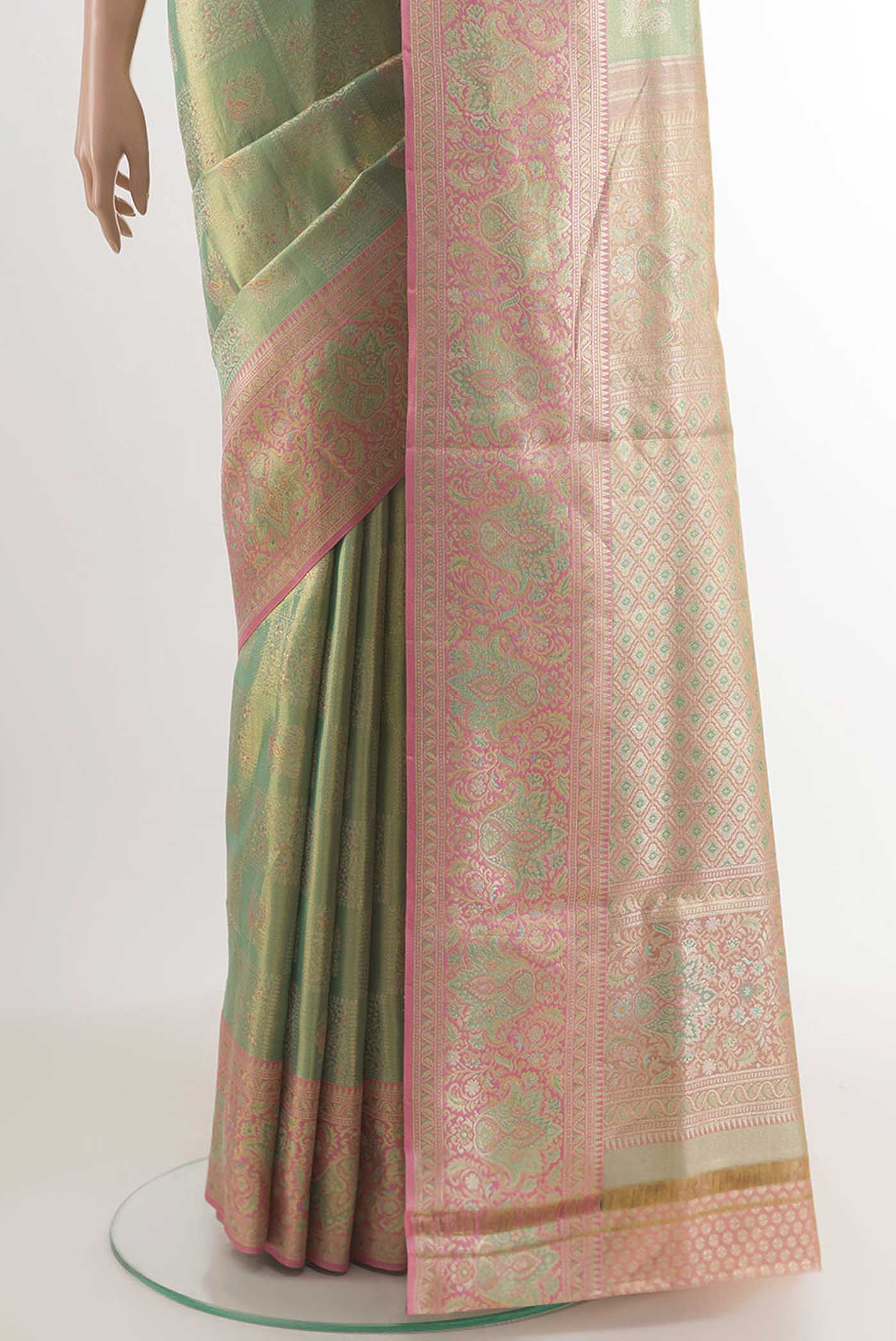 Pleats and pallu of Green Kanjivaram Tissue Silk Saree with Zari Brocade on the body and Zari Border. 