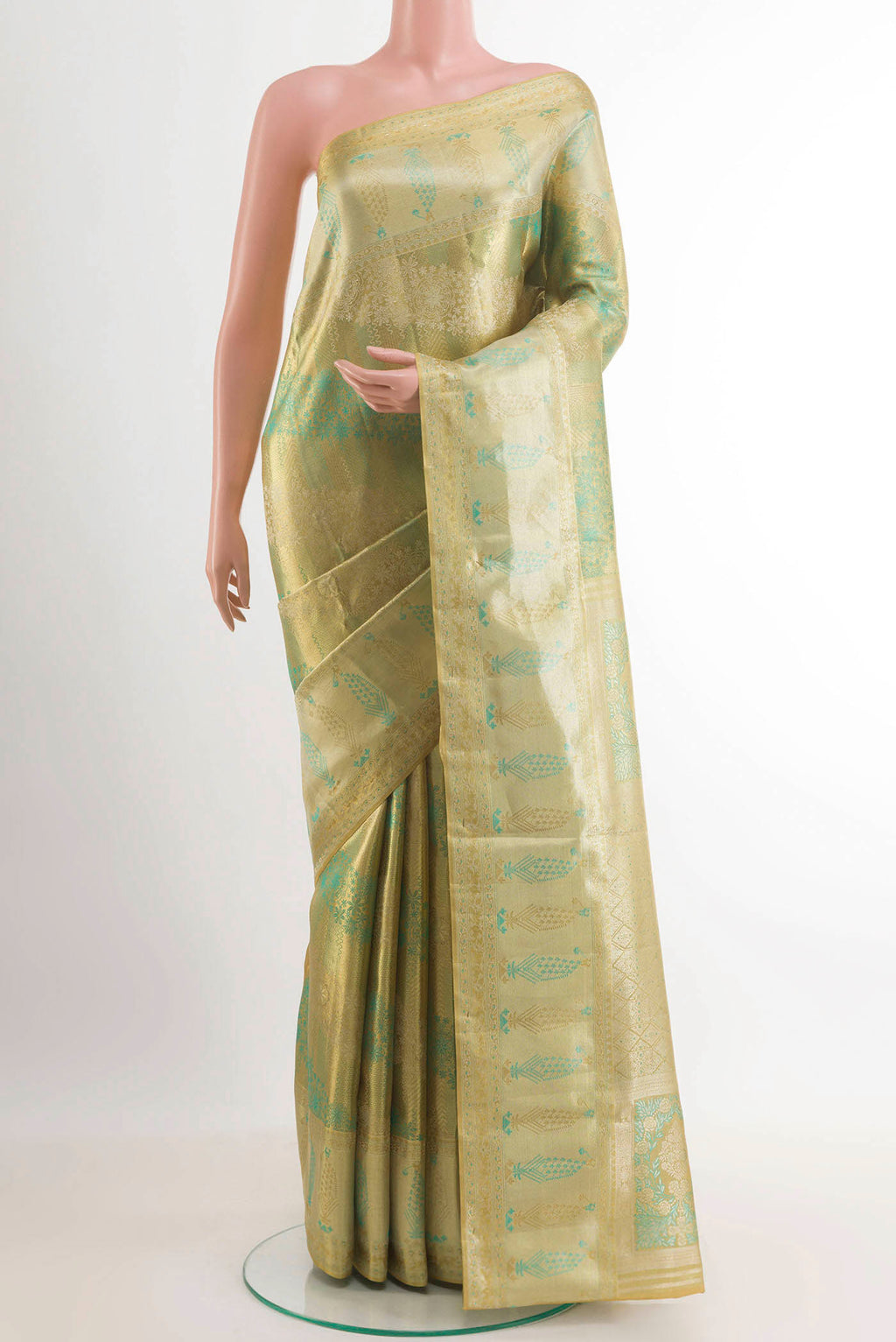 Golden Kanjivaram Tissue Silk Saree with Zari Brocade on the body and Zari Border.  displayed on a mannequin