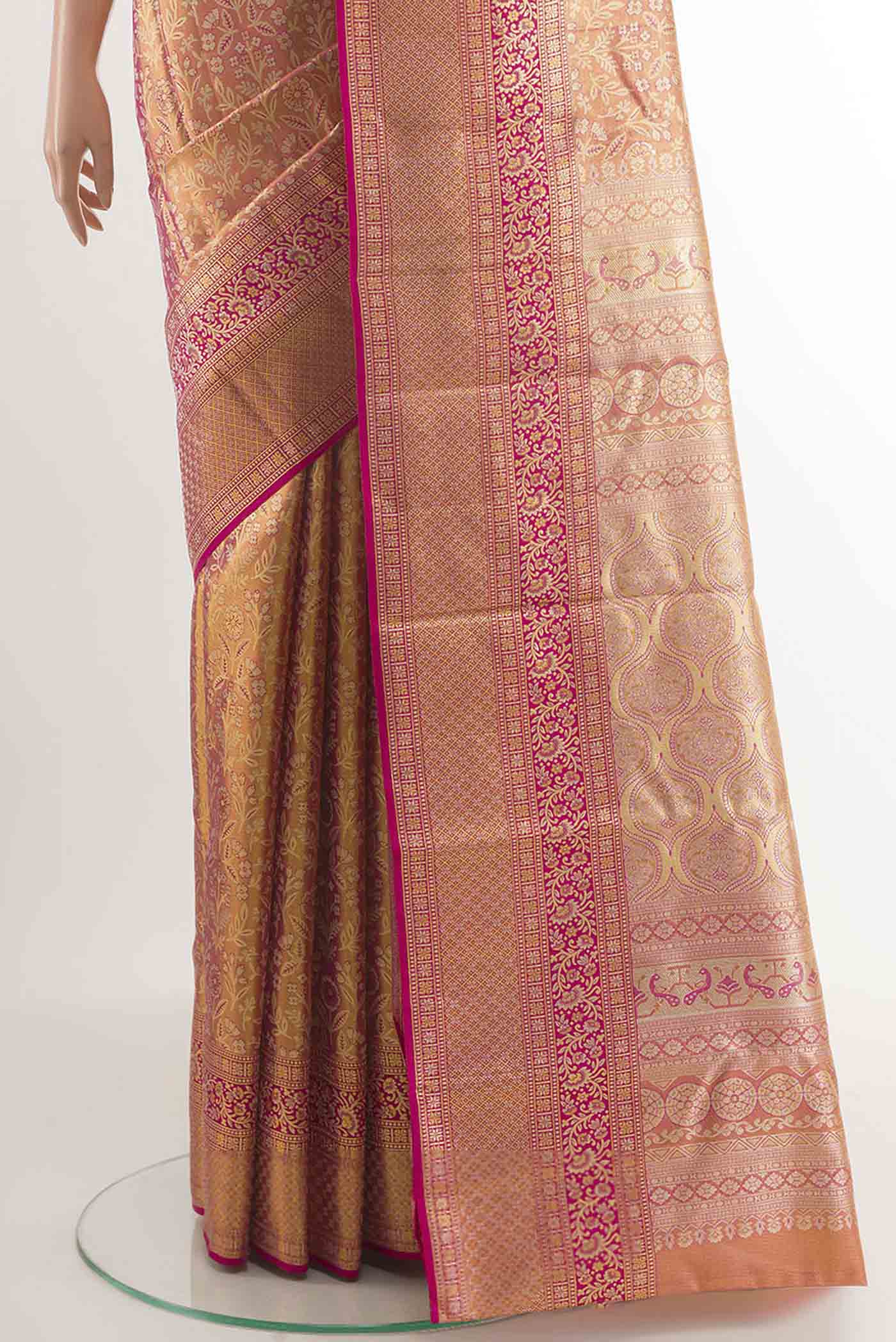 Pleats and pallu of Pink Kanchipuram Silk Saree with Zari Brocade on the body and Zari Border. 