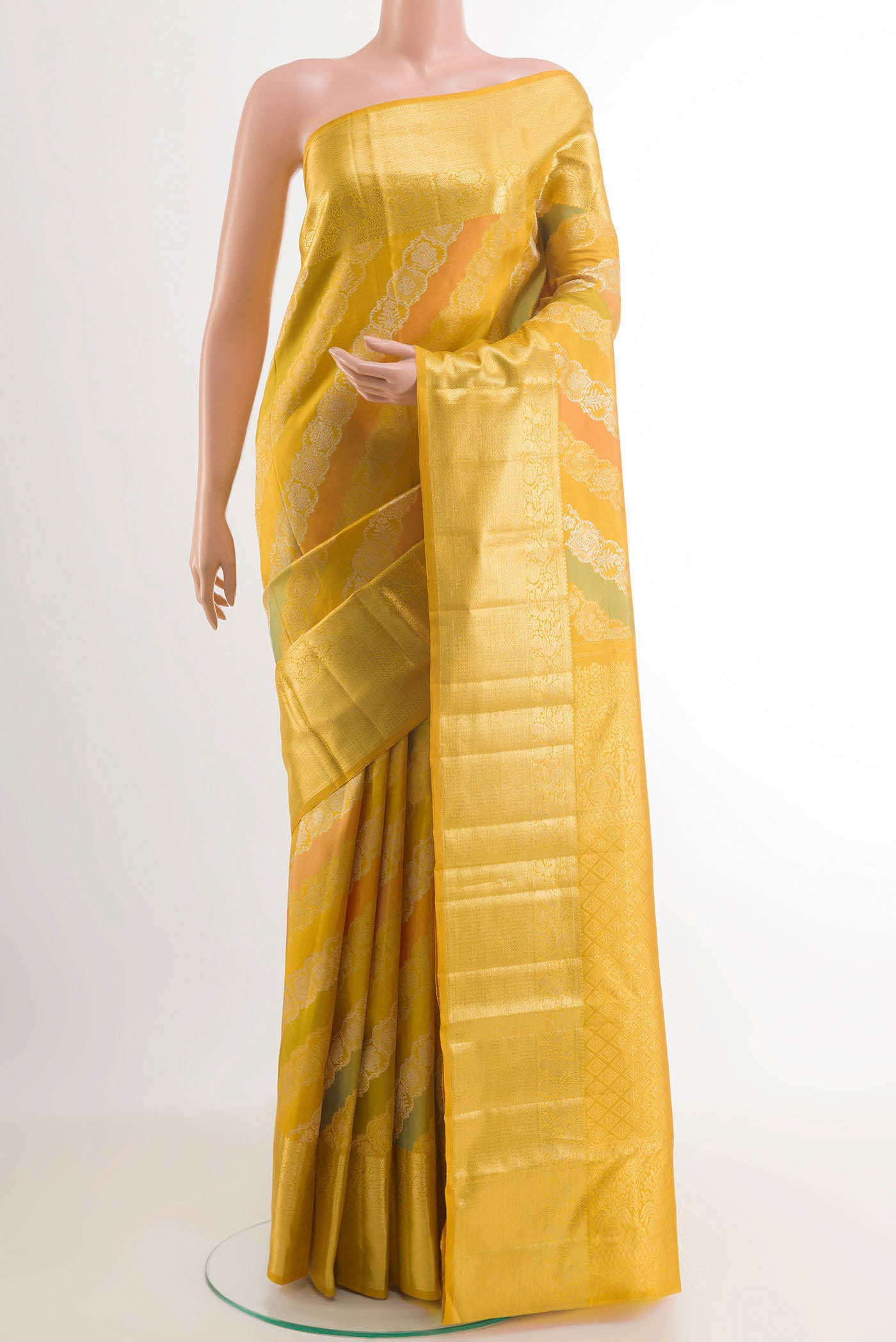 Yellow Kanjivaram Silk Saree with Zari Brocade on the body and Zari Border.  displayed on a mannequin