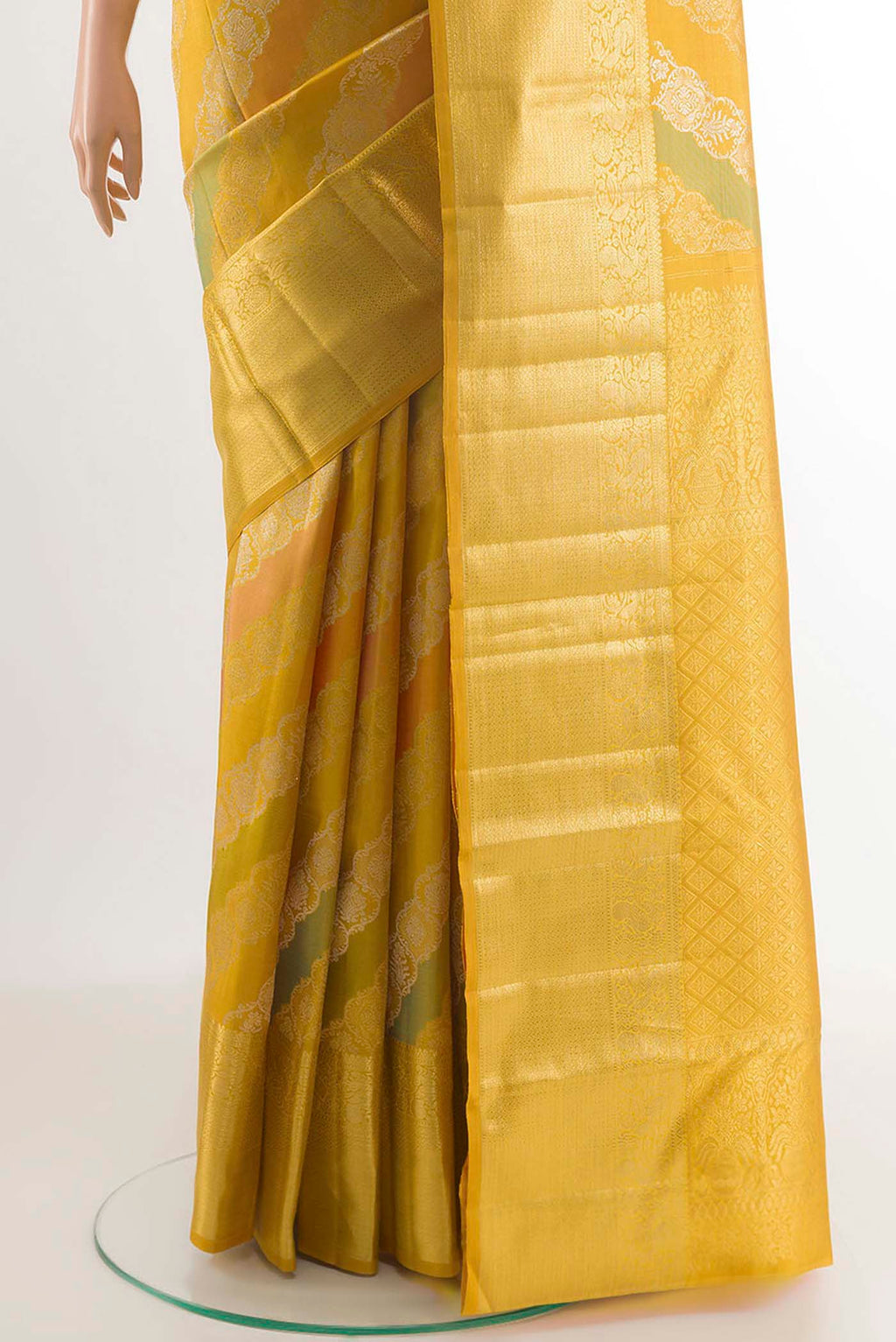Pleats and pallu of Yellow Kanjivaram Silk Saree with Zari Brocade on the body and Zari Border. 