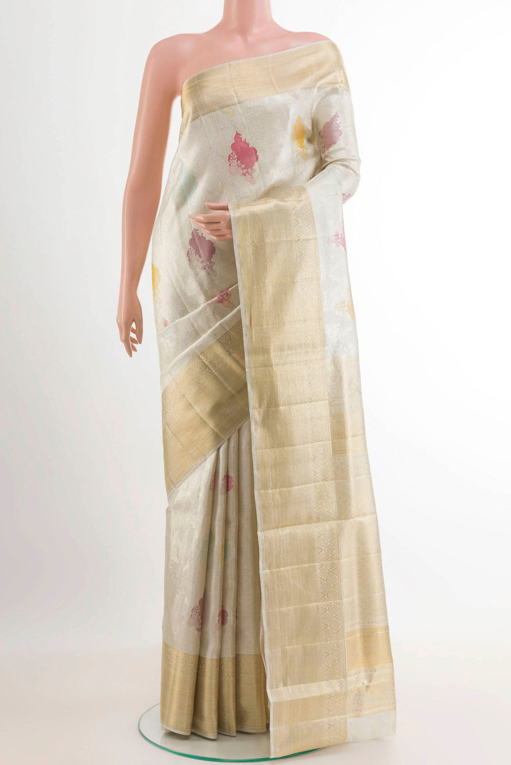 Pure Silk Pure Zari Off White Kanjivaram Tissue Saree with Zari Brocade on the body and Zari Border.  displayed on a mannequin