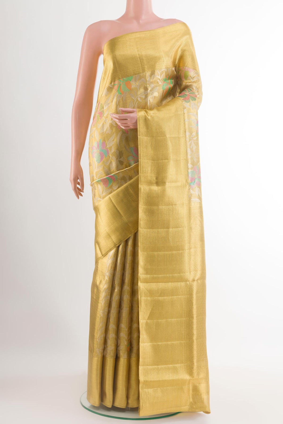 Golden Kanjivaram Tissue Silk Saree with Zari Brocade on the body and Zari Border.  displayed on a mannequin