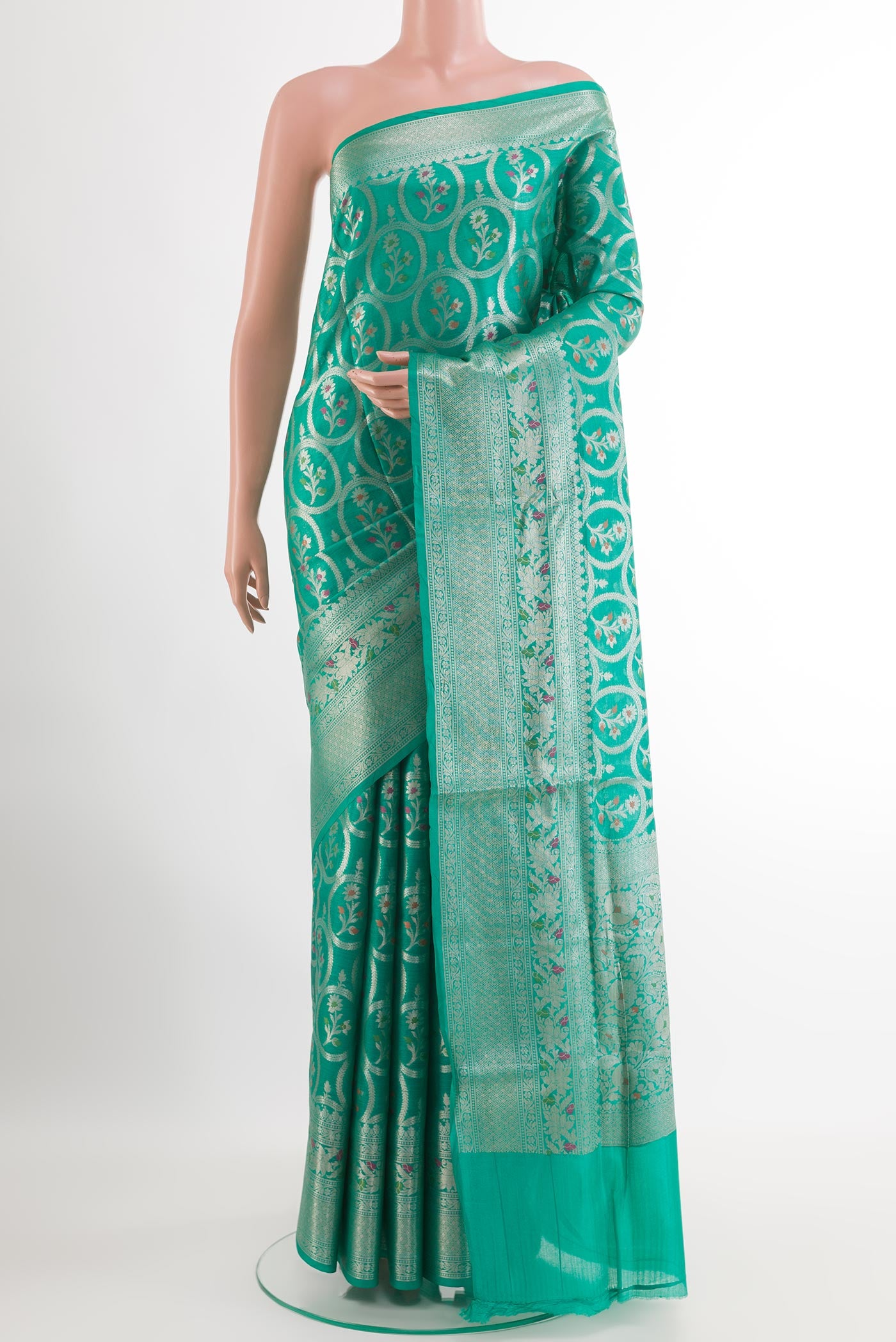 Sea Green Tussar Silk Saree with Zari Brocade on the body and Zari Border.  displayed on a mannequin