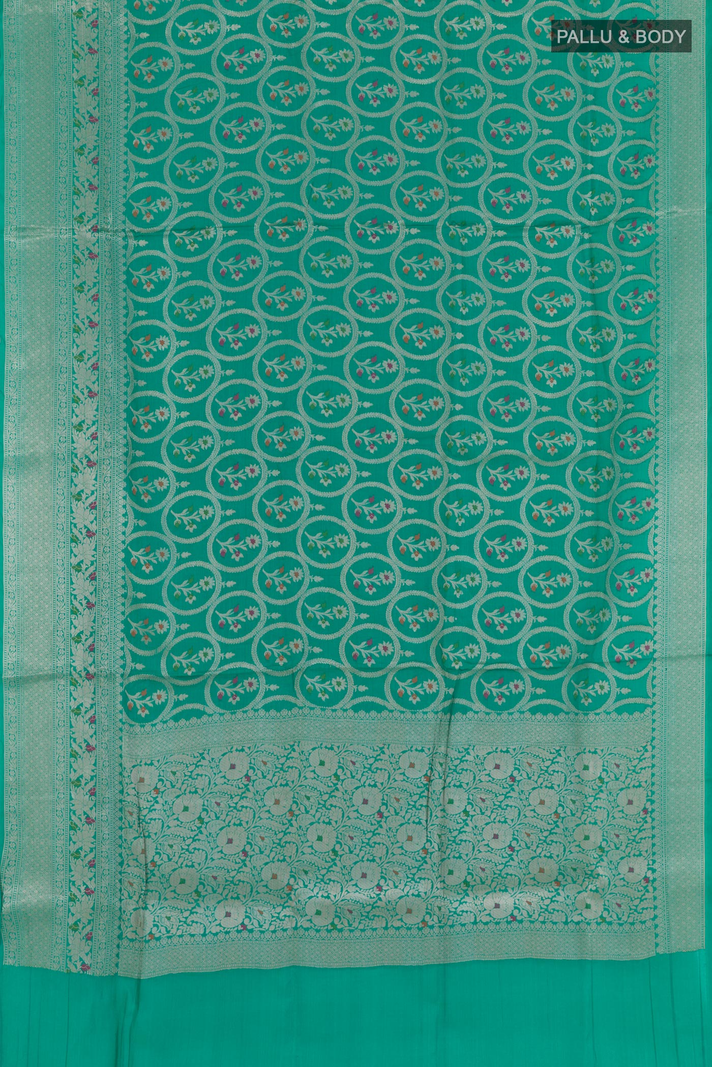 Flat view of Sea Green Tussar Silk Saree with Zari Brocade on the body and Zari Border. 