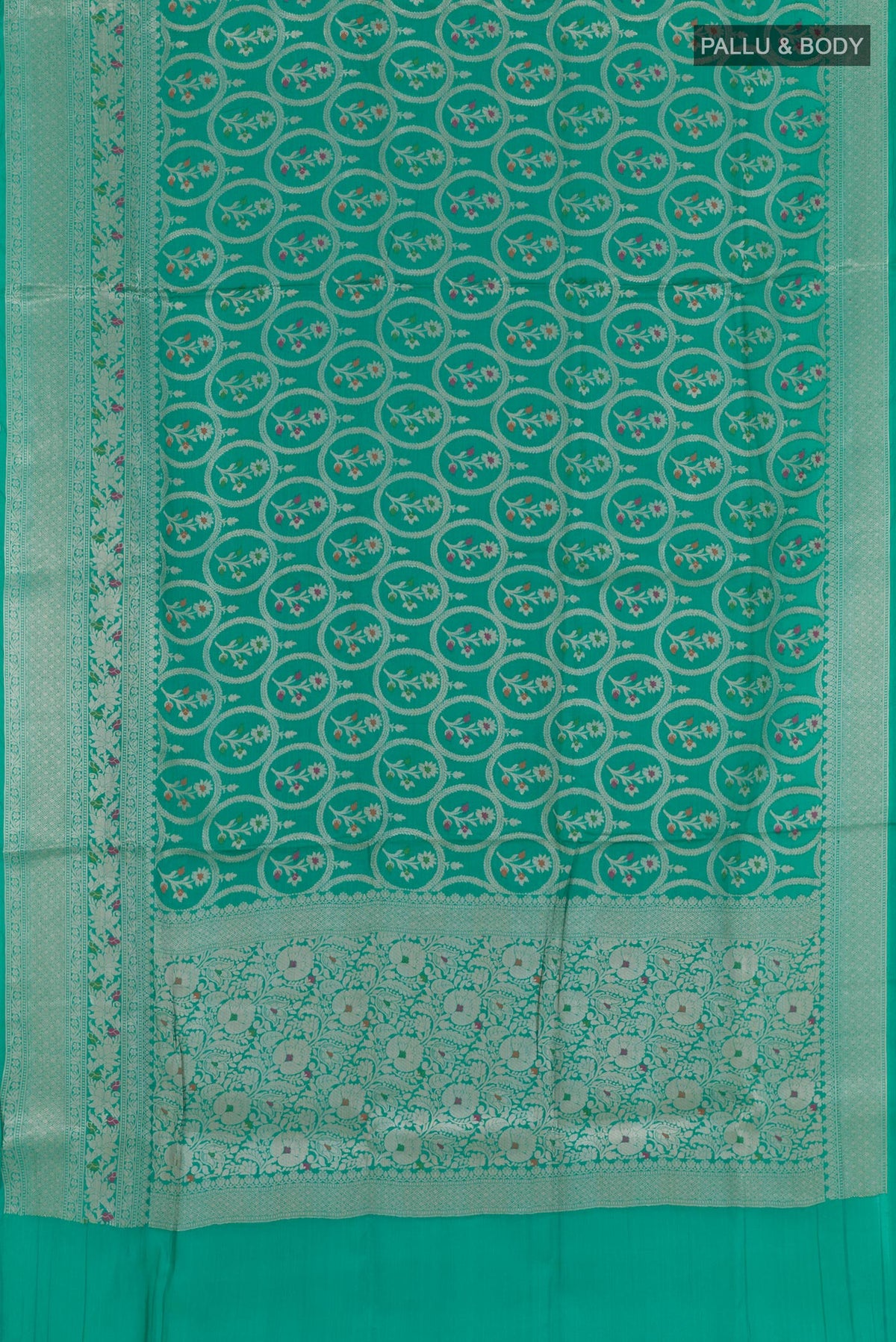 Flat view of Sea Green Tussar Silk Saree with Zari Brocade on the body and Zari Border. 