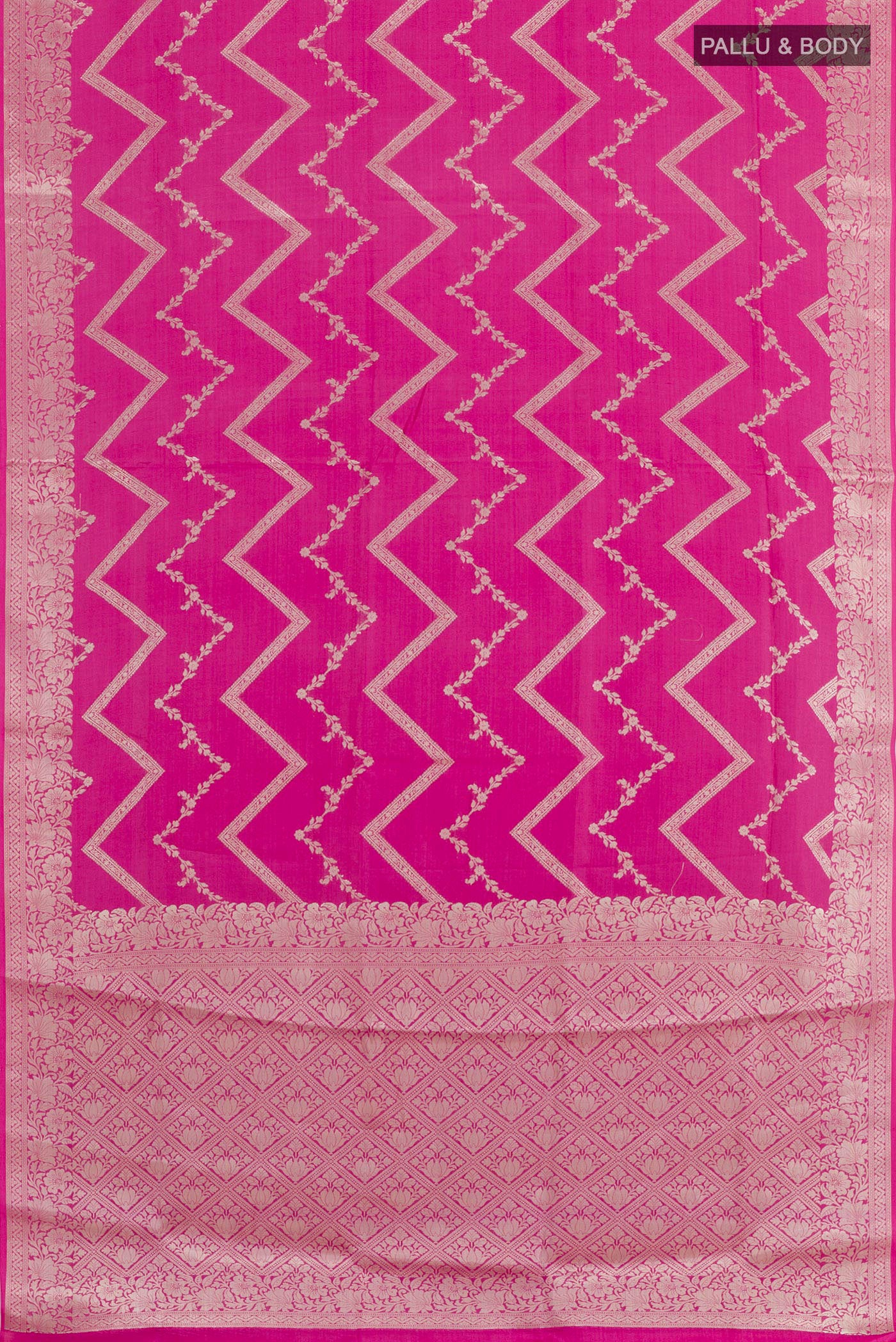 Flat view of Pink Tussar Silk Saree with Zari Brocade on the body and Zari Border. 