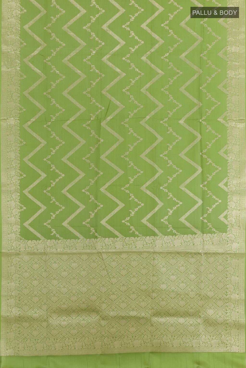 Flat view of Green Tussar Silk Saree with Zari Brocade on the body and Zari Border. 