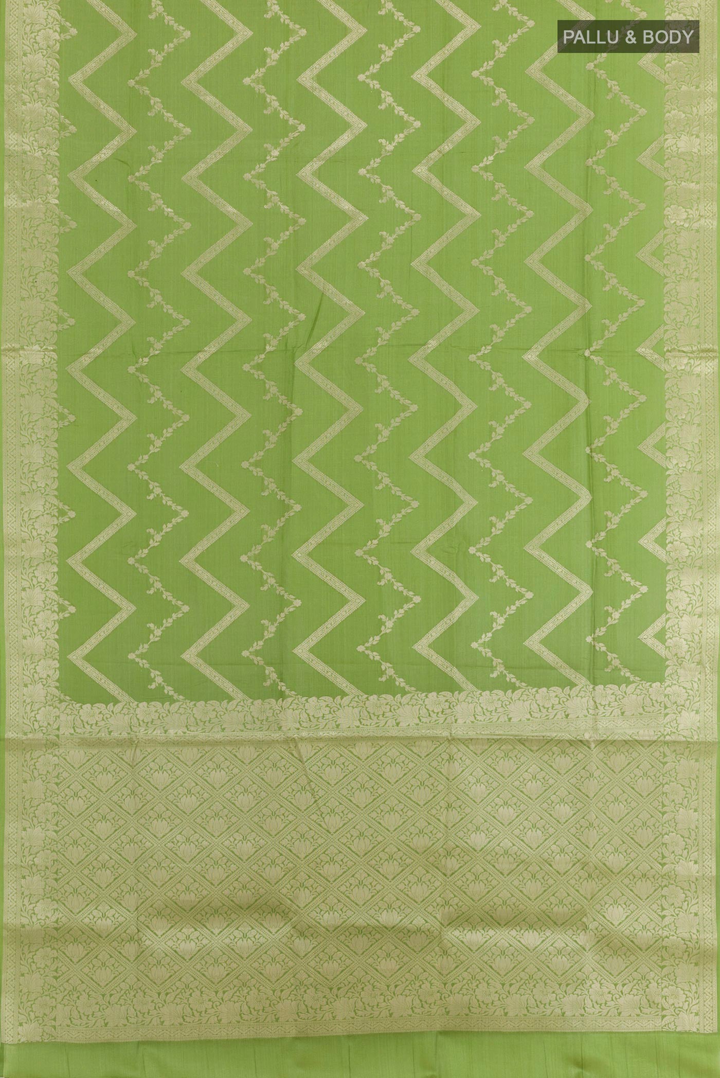 Flat view of Green Tussar Silk Saree with Zari Brocade on the body and Zari Border. 