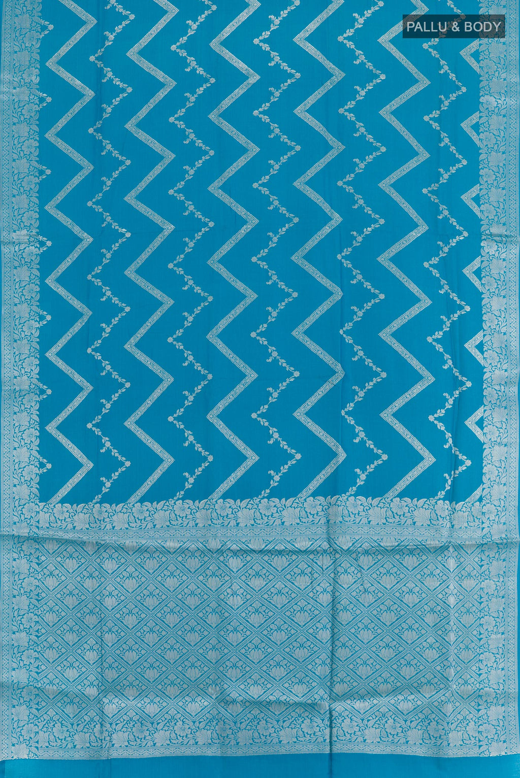 Flat view of Blue Tussar Silk Saree with Zari Brocade on the body and Zari Border. 