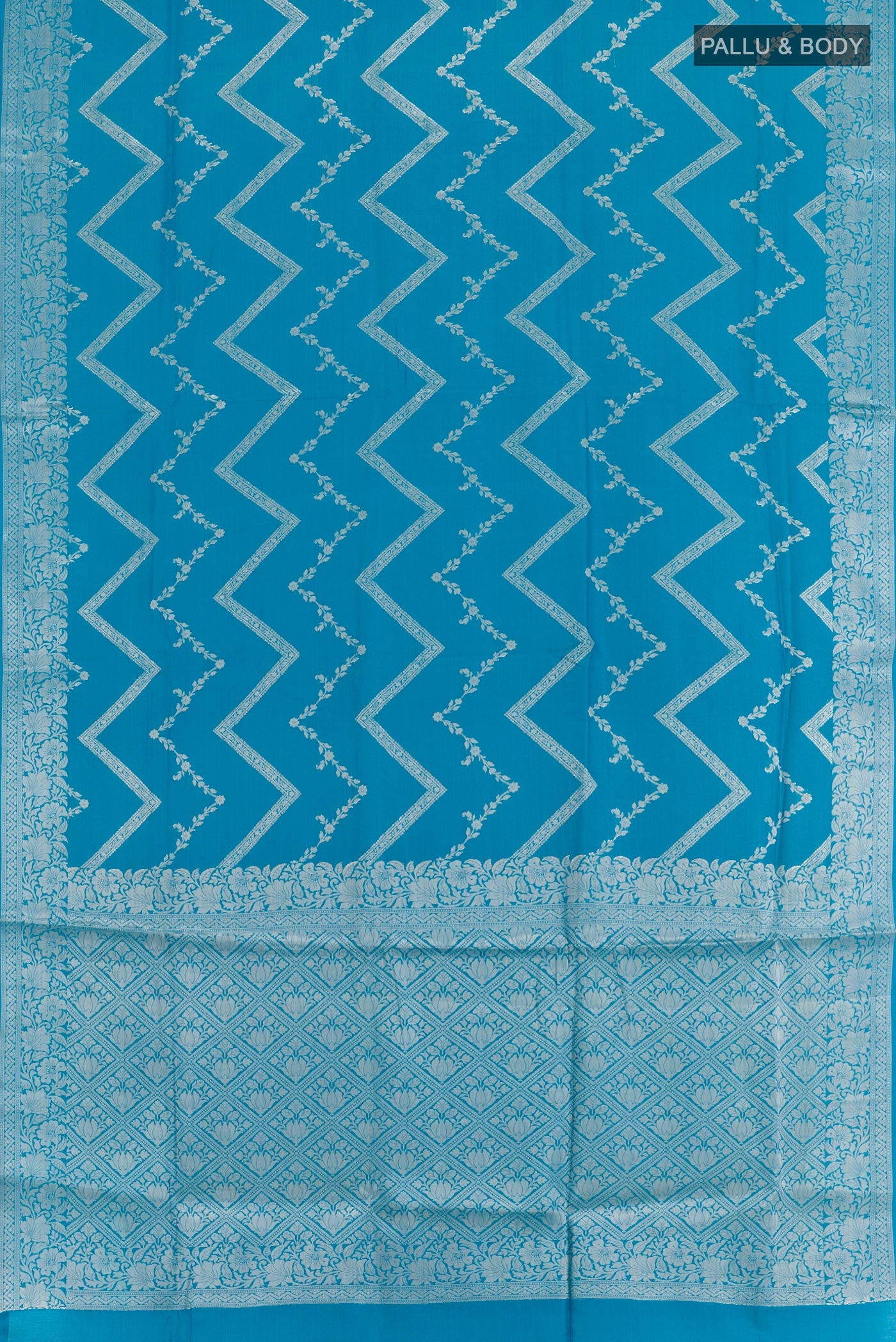 Flat view of Blue Tussar Silk Saree with Zari Brocade on the body and Zari Border. 