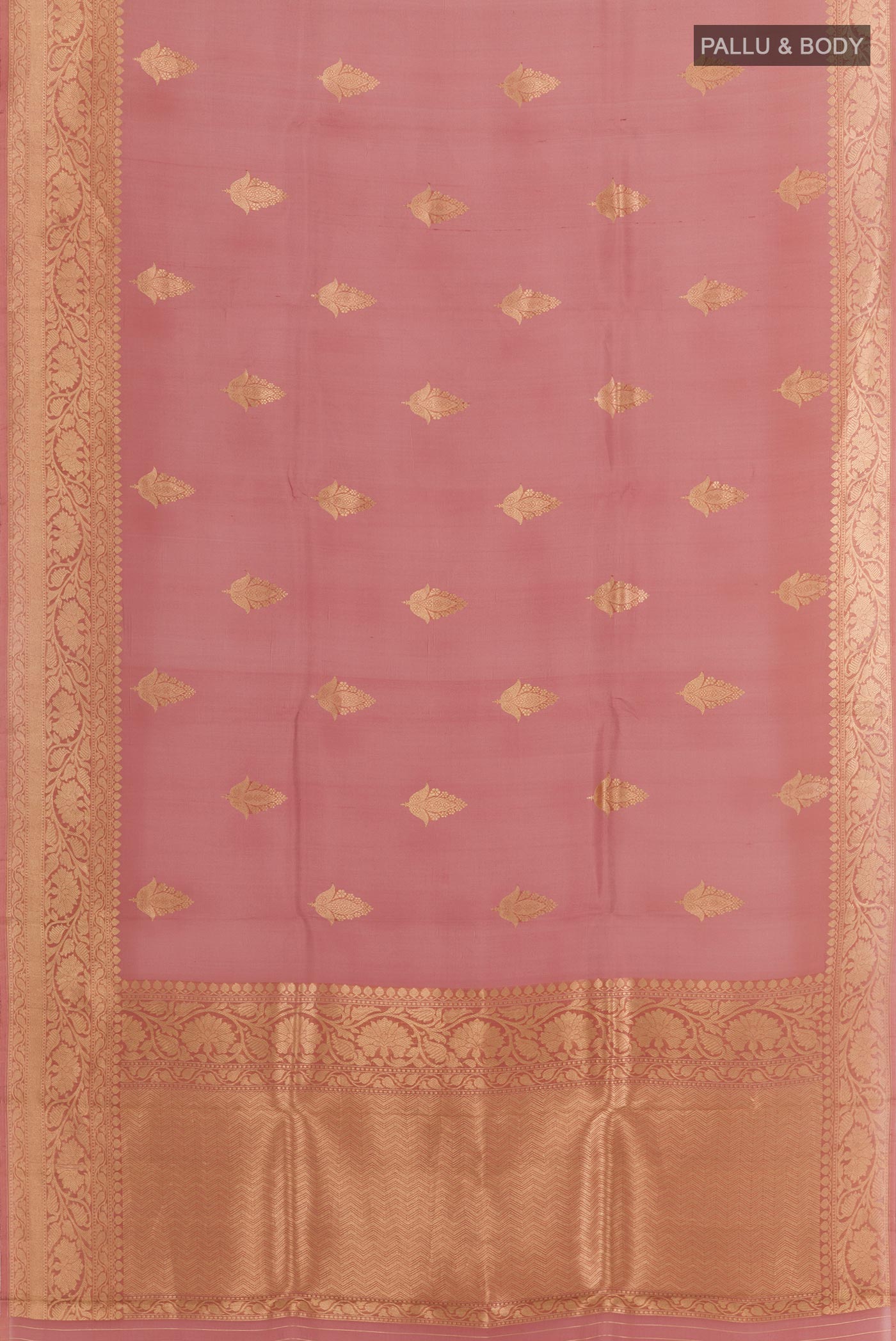 Flat view of Peach Organza Silk Saree with Zari Butta on the body and Zari Border. 