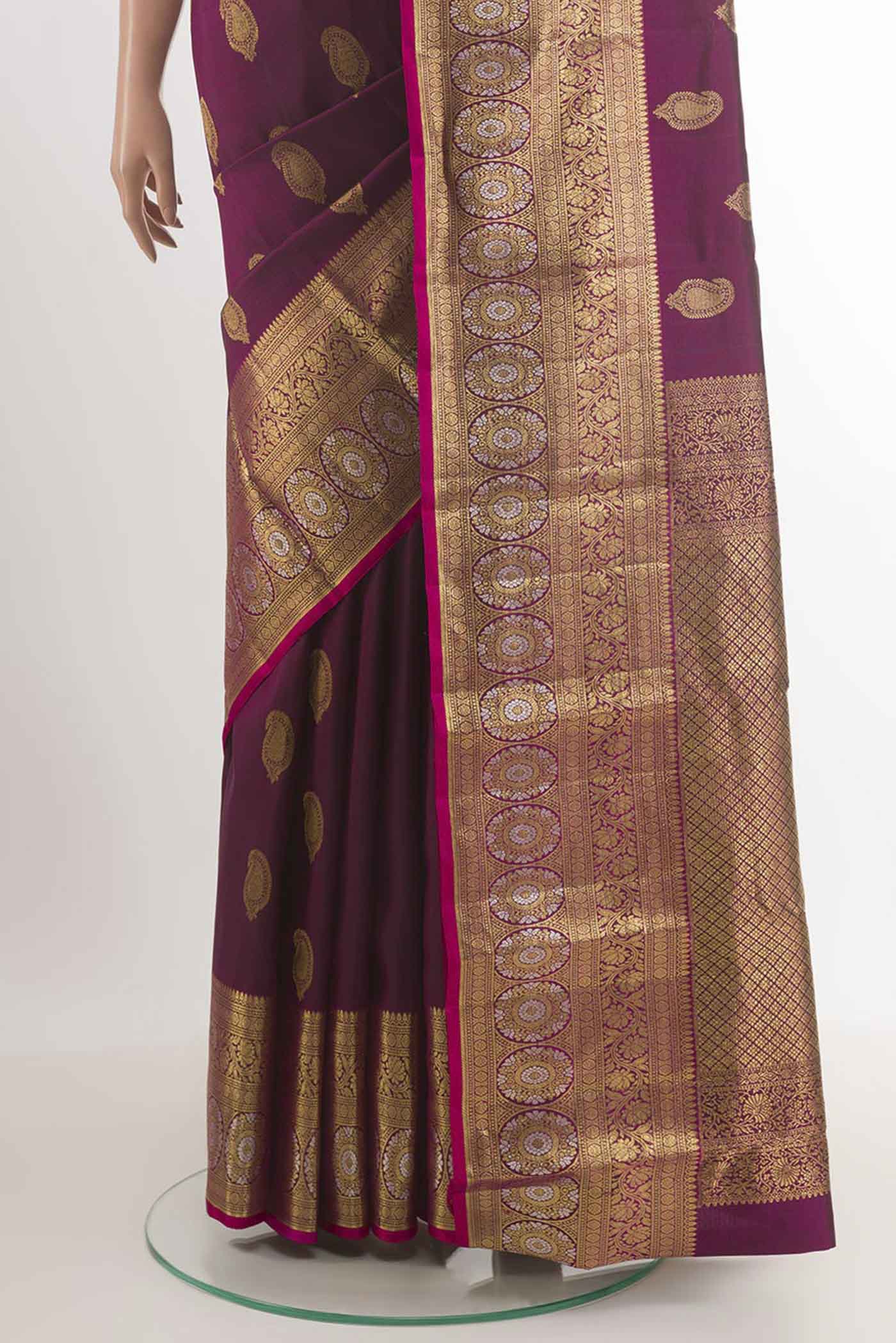 Pleats and pallu of Purple Kanjivaram Silk Saree with Zari Butta on the body and Zari Border. 