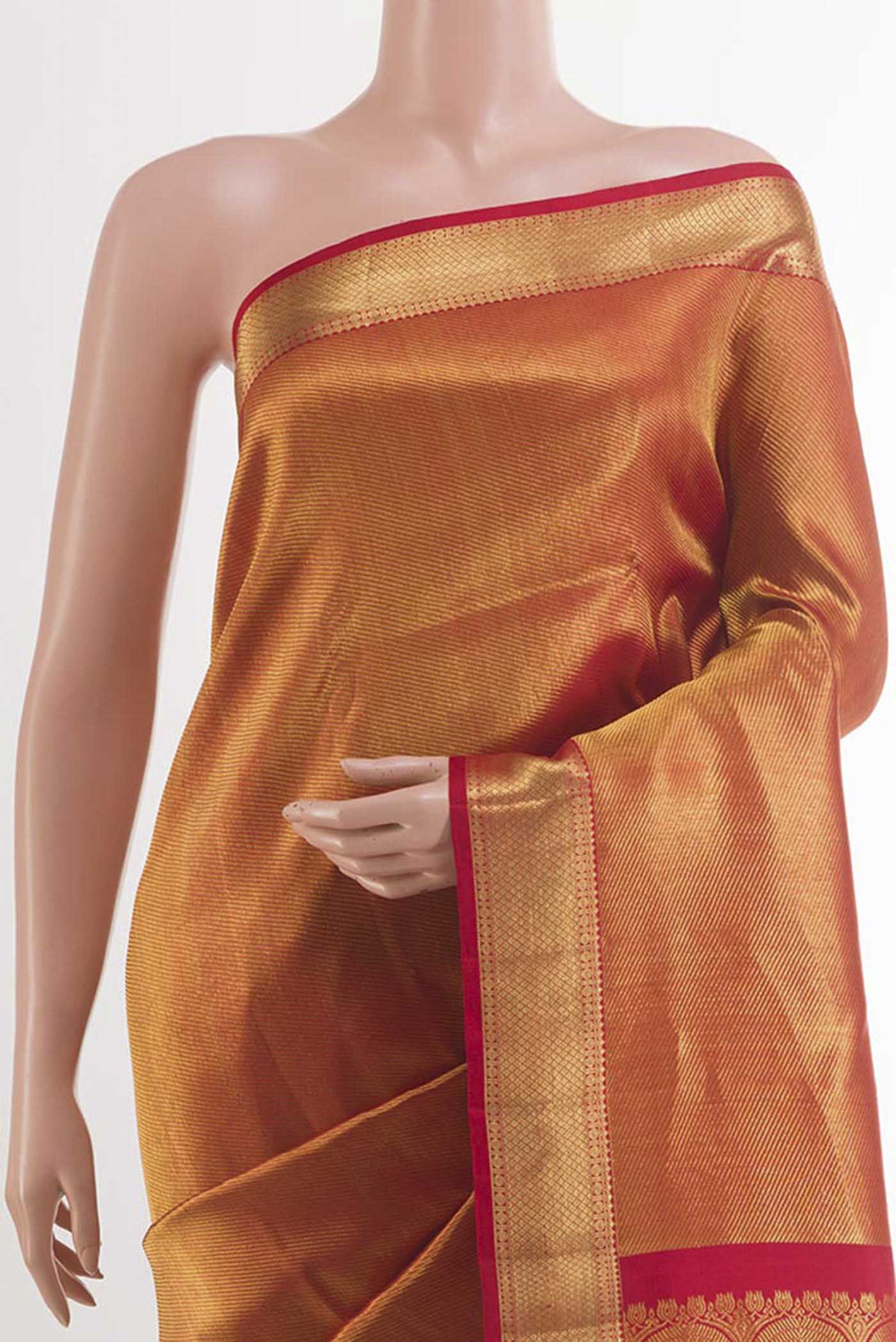 Border image of Golden Kanchipuram Silk Saree with Zari Brocade on the body and Ganga Jamuna Border. 