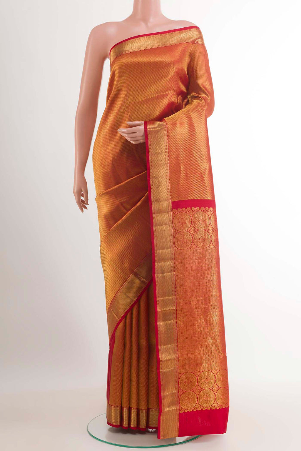 Golden Kanchipuram Silk Saree with Zari Brocade on the body and Ganga Jamuna Border.  displayed on a mannequin