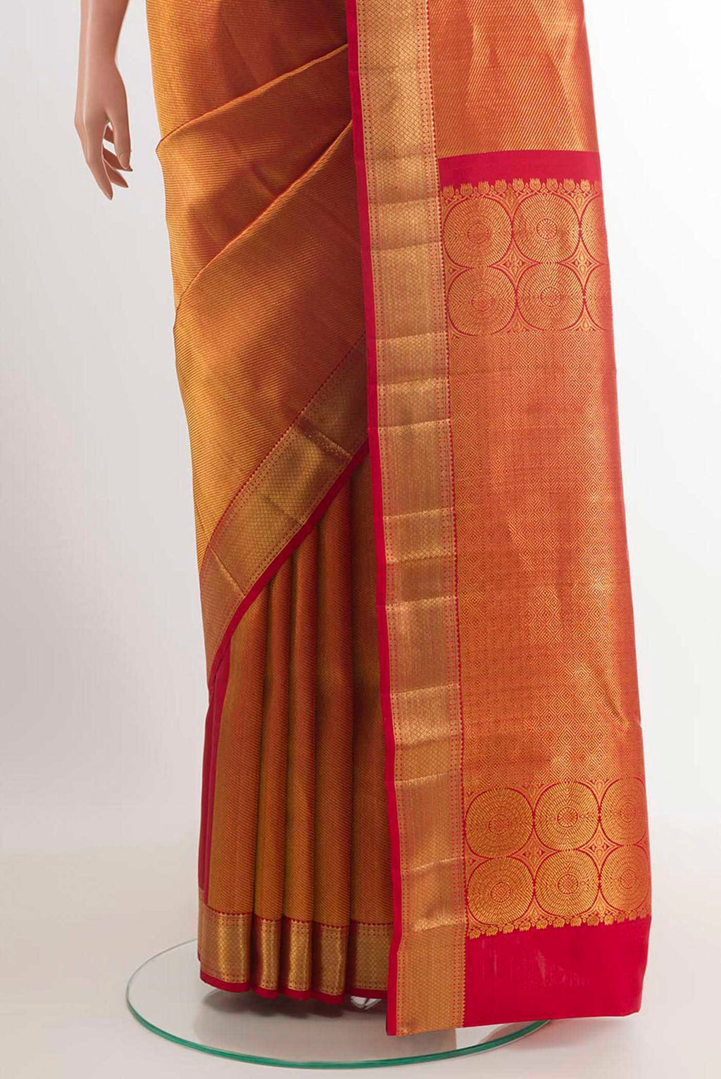 Pleats and pallu of Golden Kanchipuram Silk Saree with Zari Brocade on the body and Ganga Jamuna Border. 