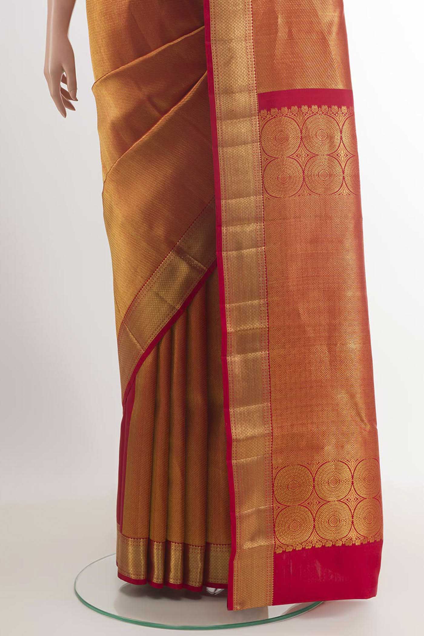 Pleats and pallu of Golden Kanchipuram Silk Saree with Zari Brocade on the body and Ganga Jamuna Border. 