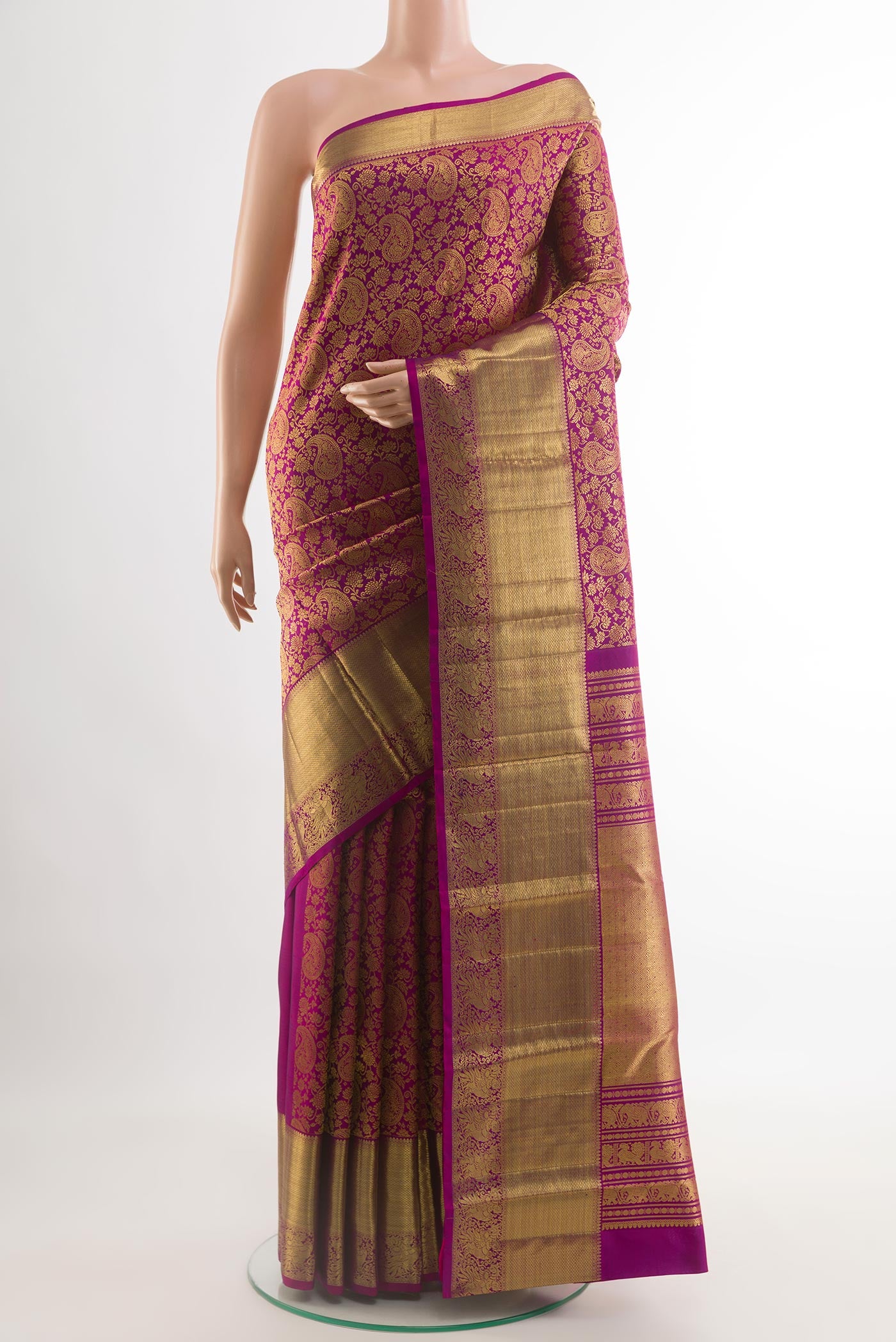Purple Kanchipuram Silk Saree with Zari Brocade on the body and Zari Border.  displayed on a mannequin
