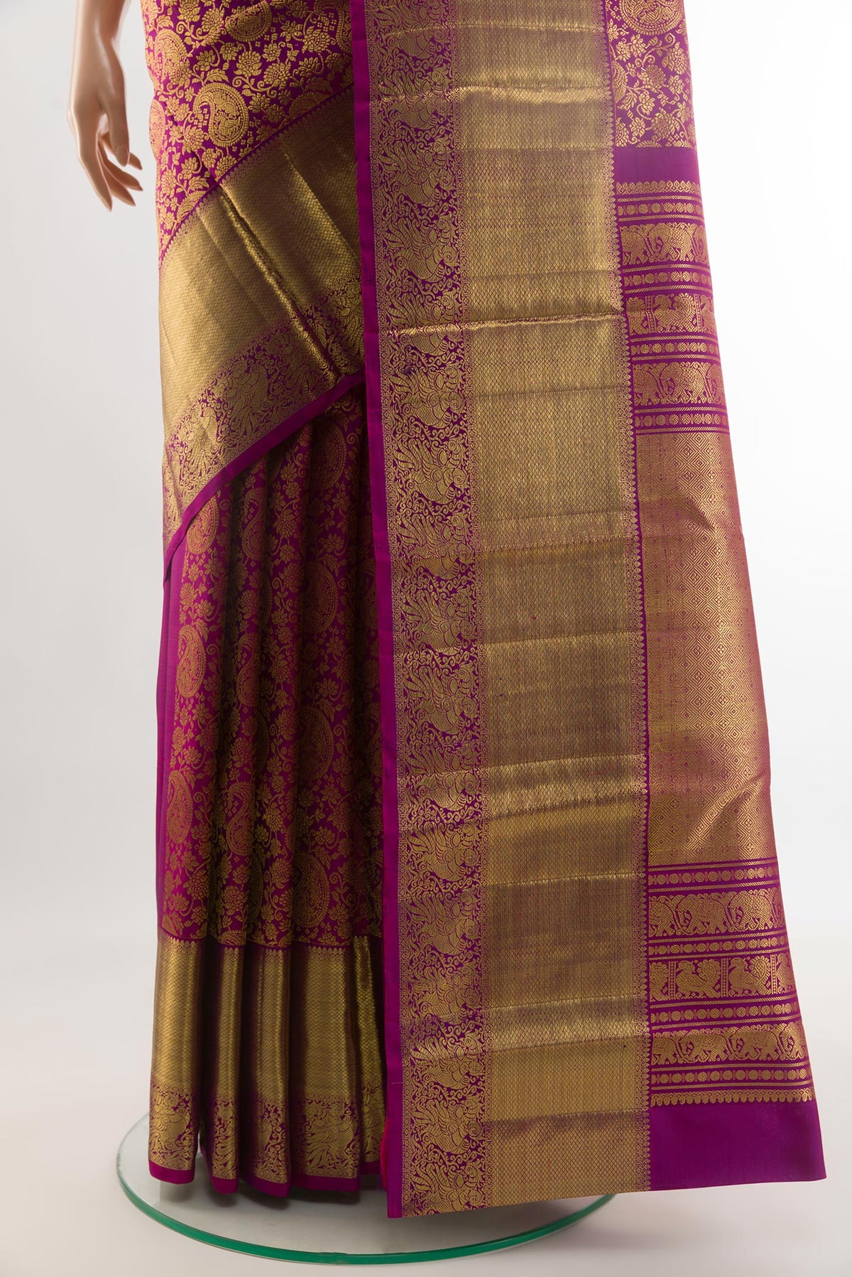 Pleats and pallu of Purple Kanchipuram Silk Saree with Zari Brocade on the body and Zari Border. 