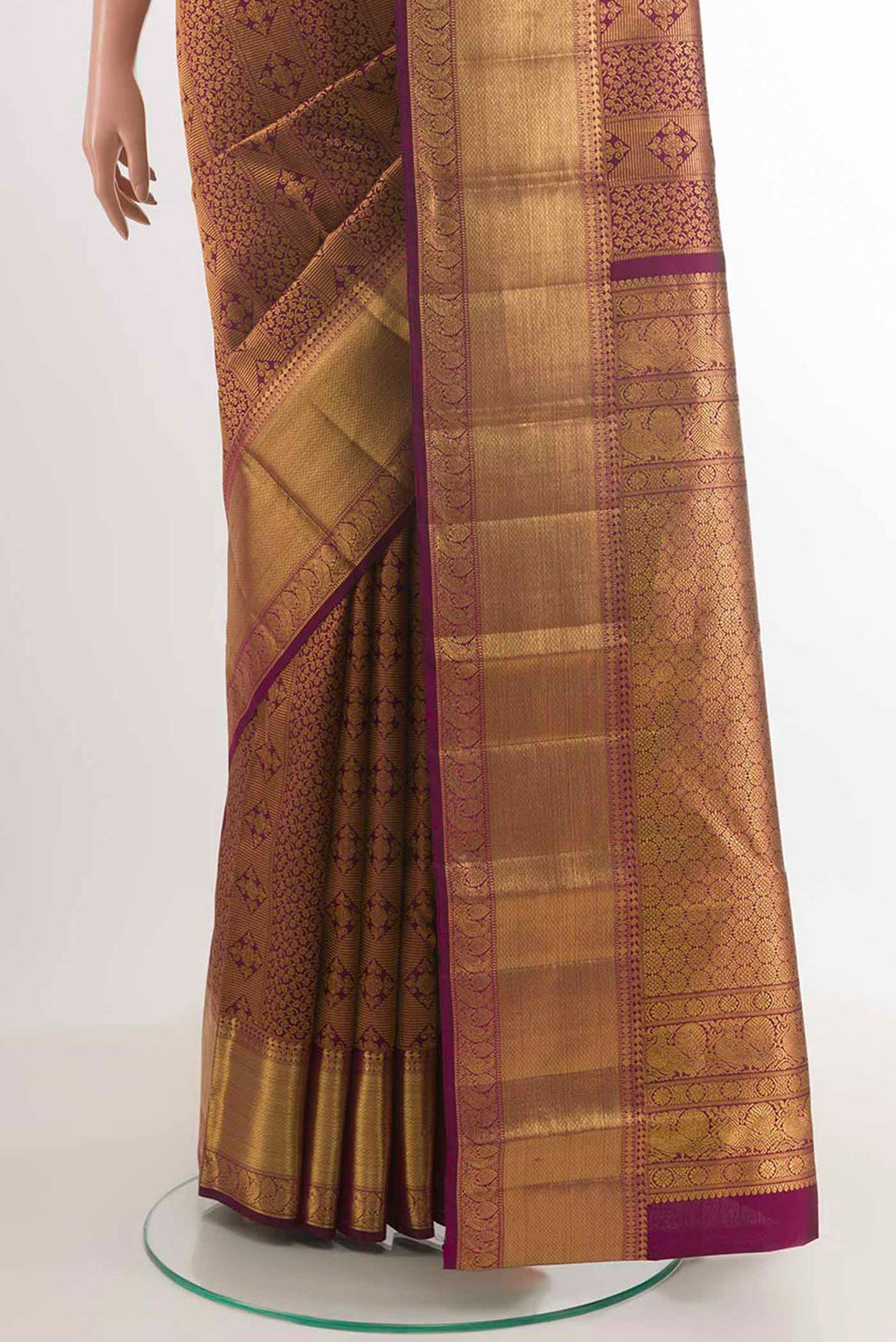Pleats and pallu of Purple Kanchipuram Silk Saree with Zari Brocade on the body and Zari Border. 