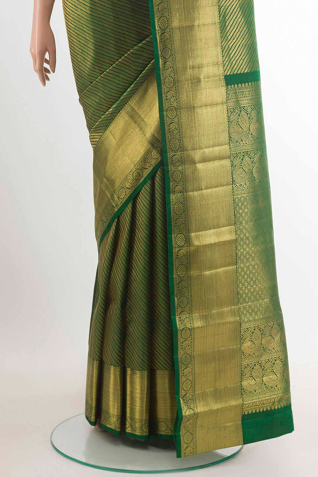 Pleats and pallu of Green Kanchipuram Silk Saree with Zari Brocade on the body and Zari Border. 
