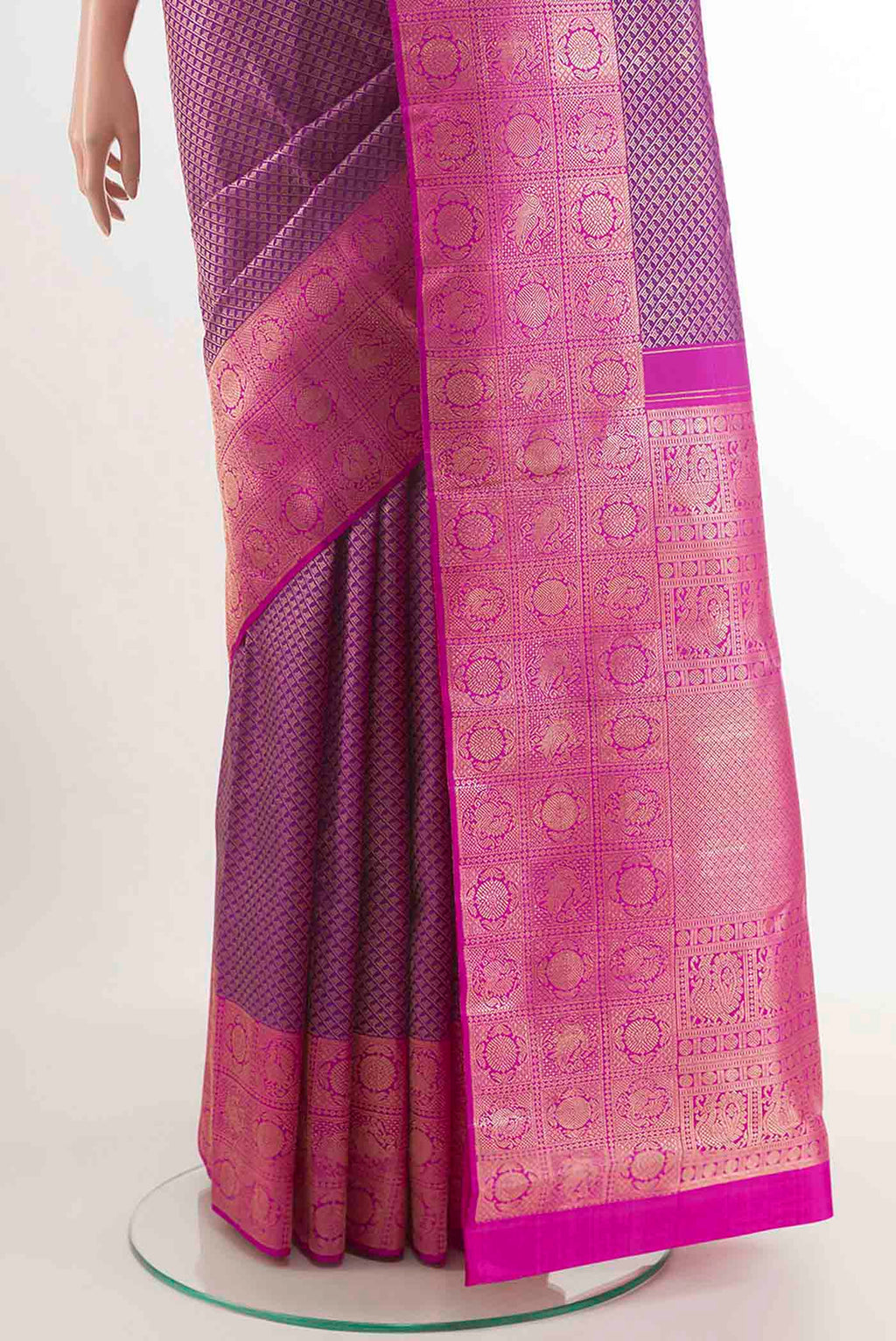Pleats and pallu of Purple Kanchipuram Silk Saree with Zari Brocade on the body and Zari Border. 