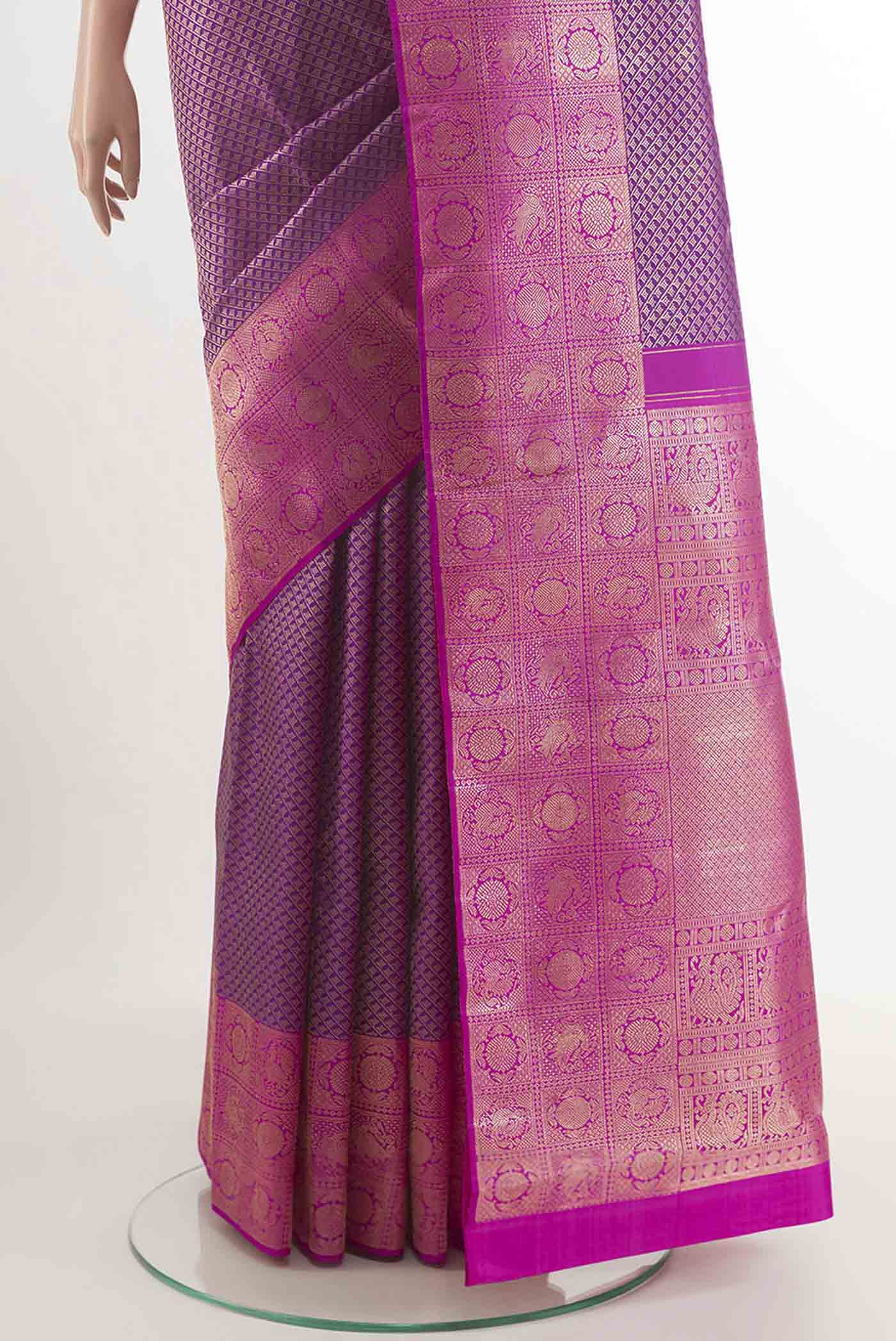 Pleats and pallu of Purple Kanchipuram Silk Saree with Zari Brocade on the body and Zari Border. 