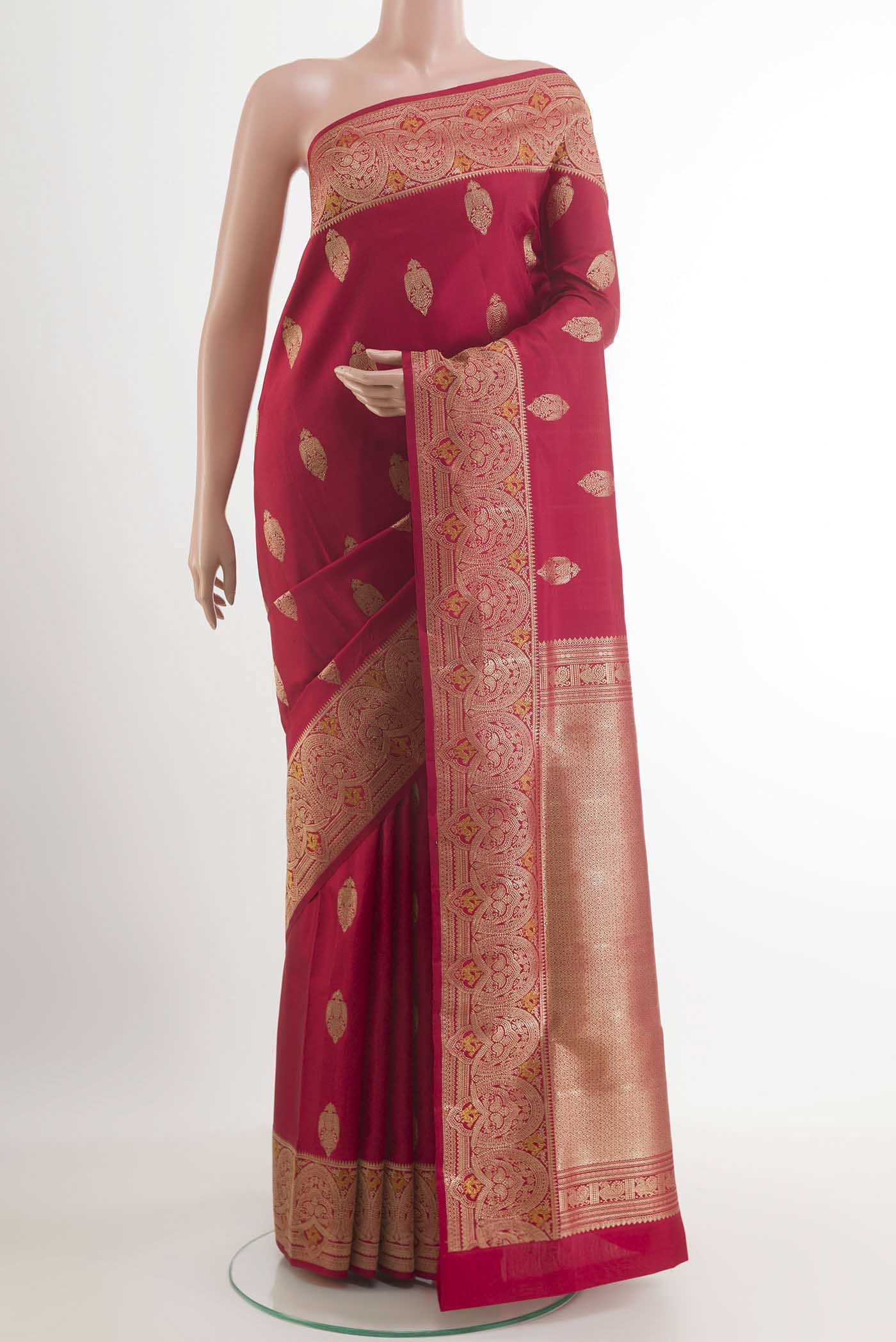 Red Kanchipuram Silk Saree with Zari Butta on the body and Zari Border.  displayed on a mannequin