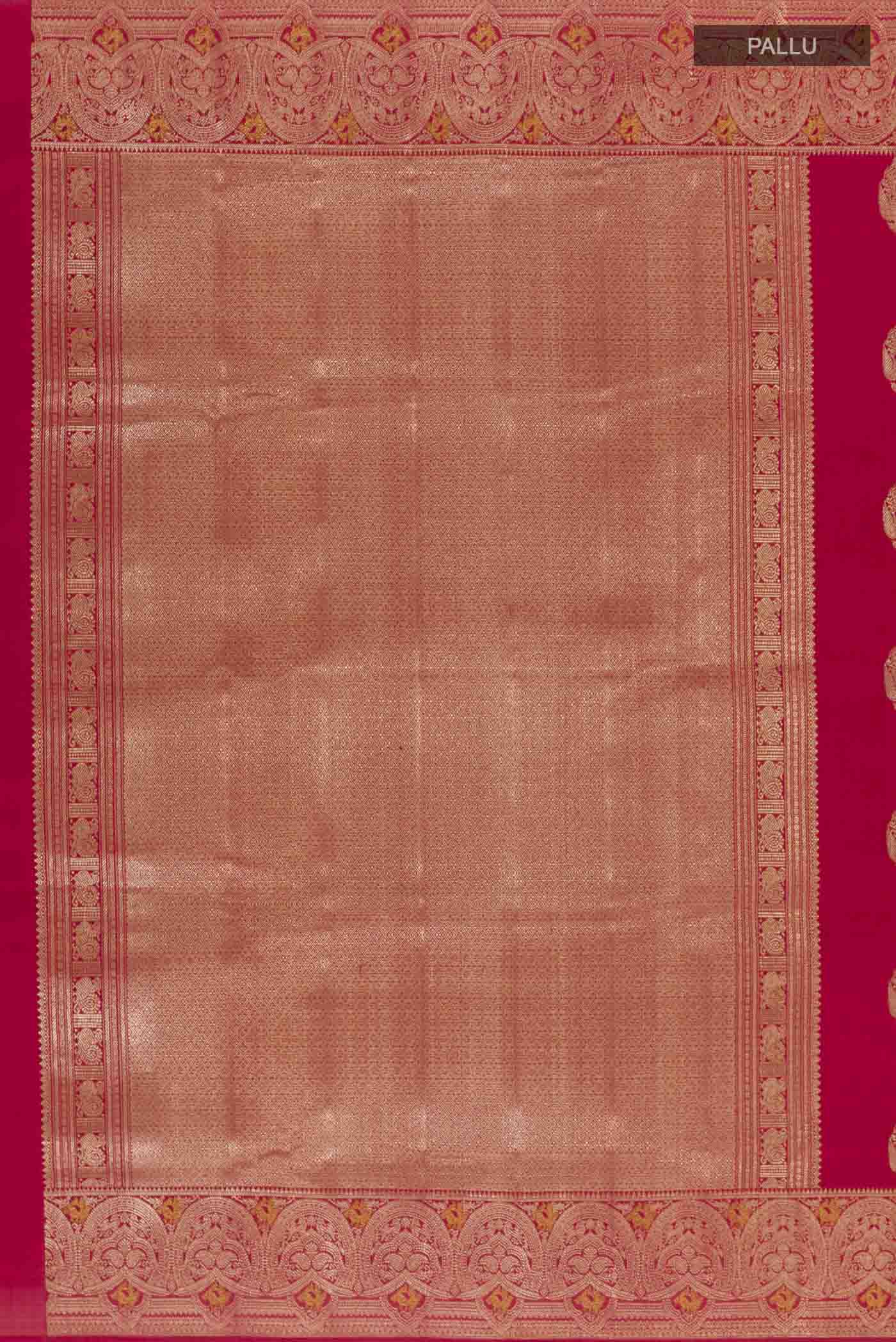 Close up image of the pallu of Red Kanchipuram Silk Saree with Zari Butta on the body and Zari Border. 