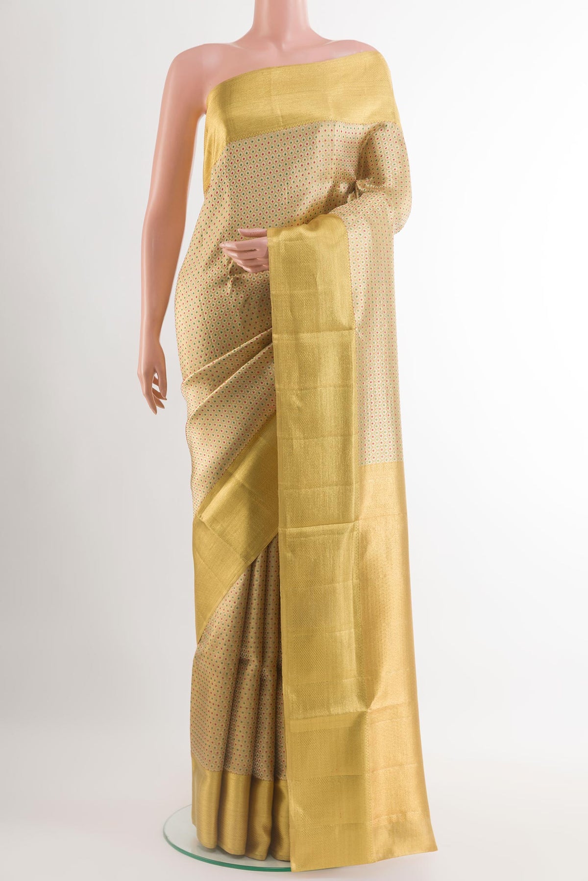 Golden Kanjivaram Tissue Silk Saree with Zari Brocade on the body and Zari Border.  displayed on a mannequin