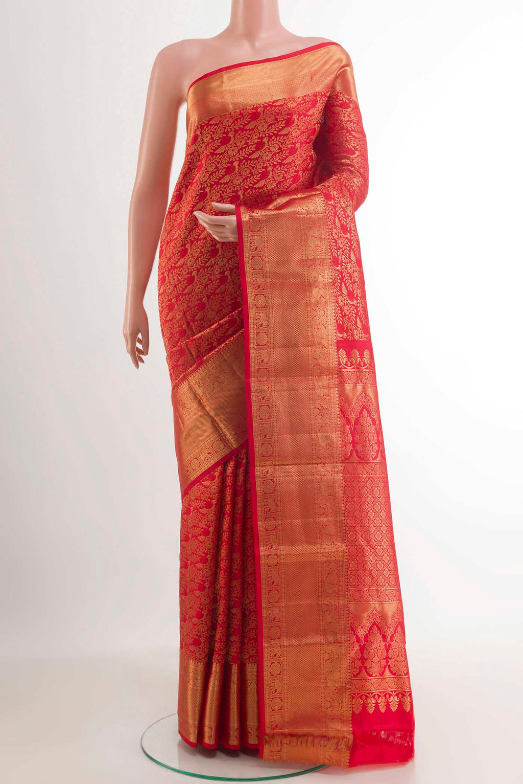 Red Kanchipuram Silk Saree with Zari Brocade on the body and Zari Border.  displayed on a mannequin