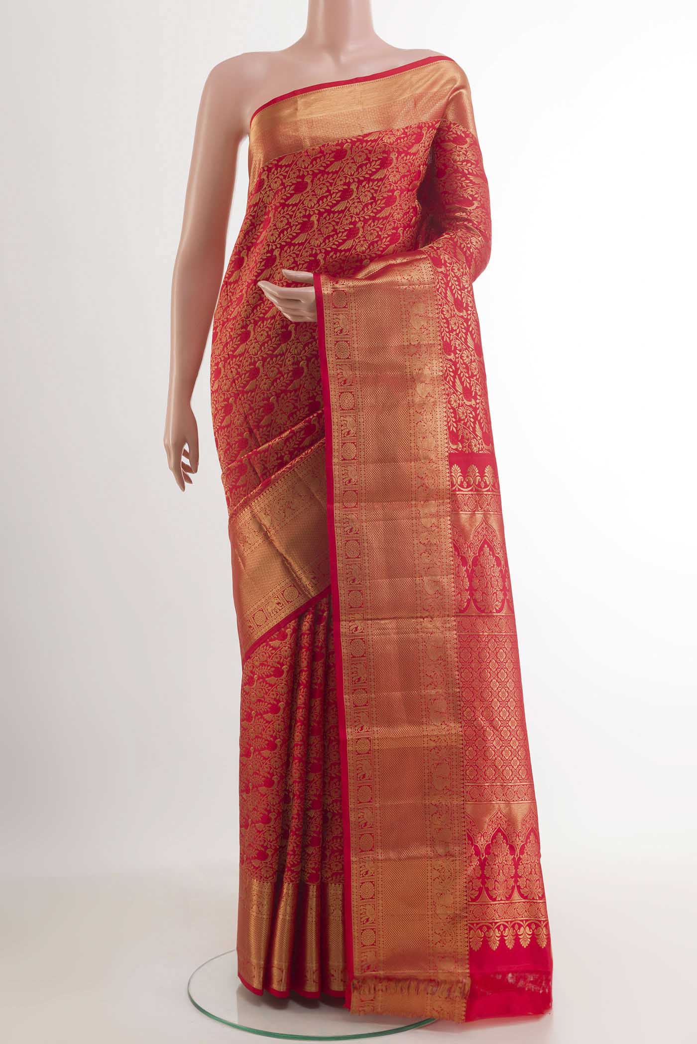 Red Kanchipuram Silk Saree with Zari Brocade on the body and Zari Border.  displayed on a mannequin