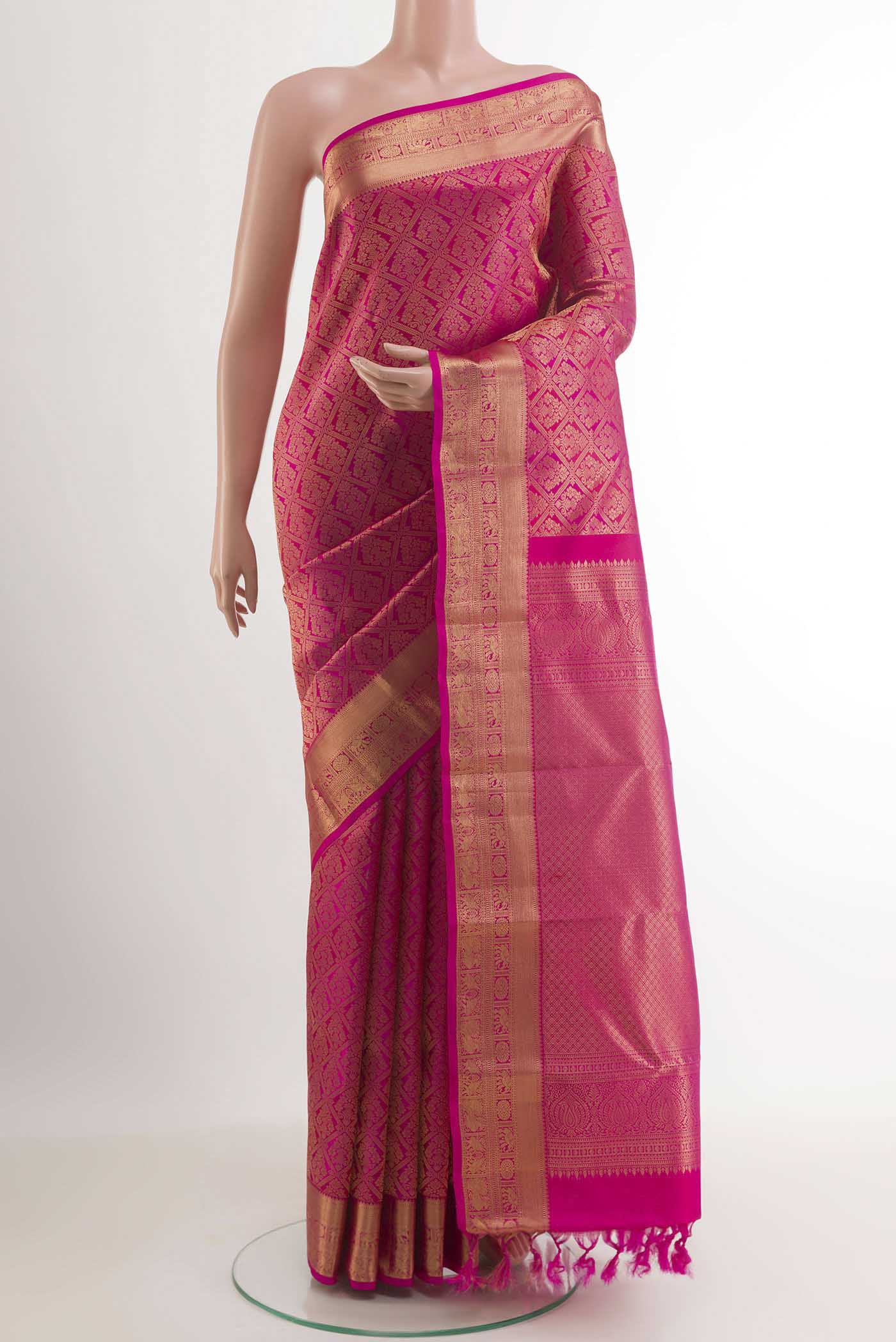 Rani Pink Kanchipuram Silk Saree with Zari Brocade on the body and Zari Border.  displayed on a mannequin