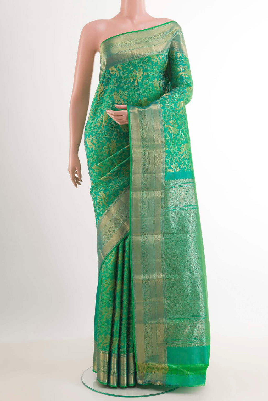 Green Dual Tone Kanchipuram Silk Saree with Zari Brocade on the body and Zari Border.  displayed on a mannequin