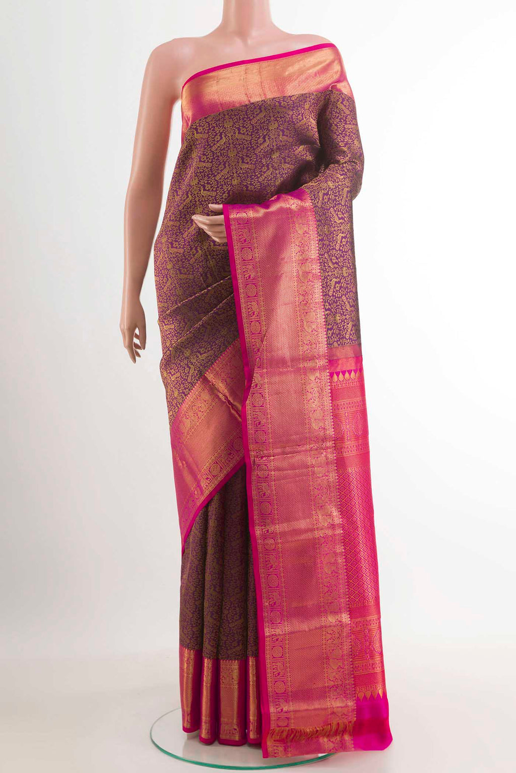 Purple Kanchipuram Silk Saree with Zari Brocade on the body and Zari Border.  displayed on a mannequin