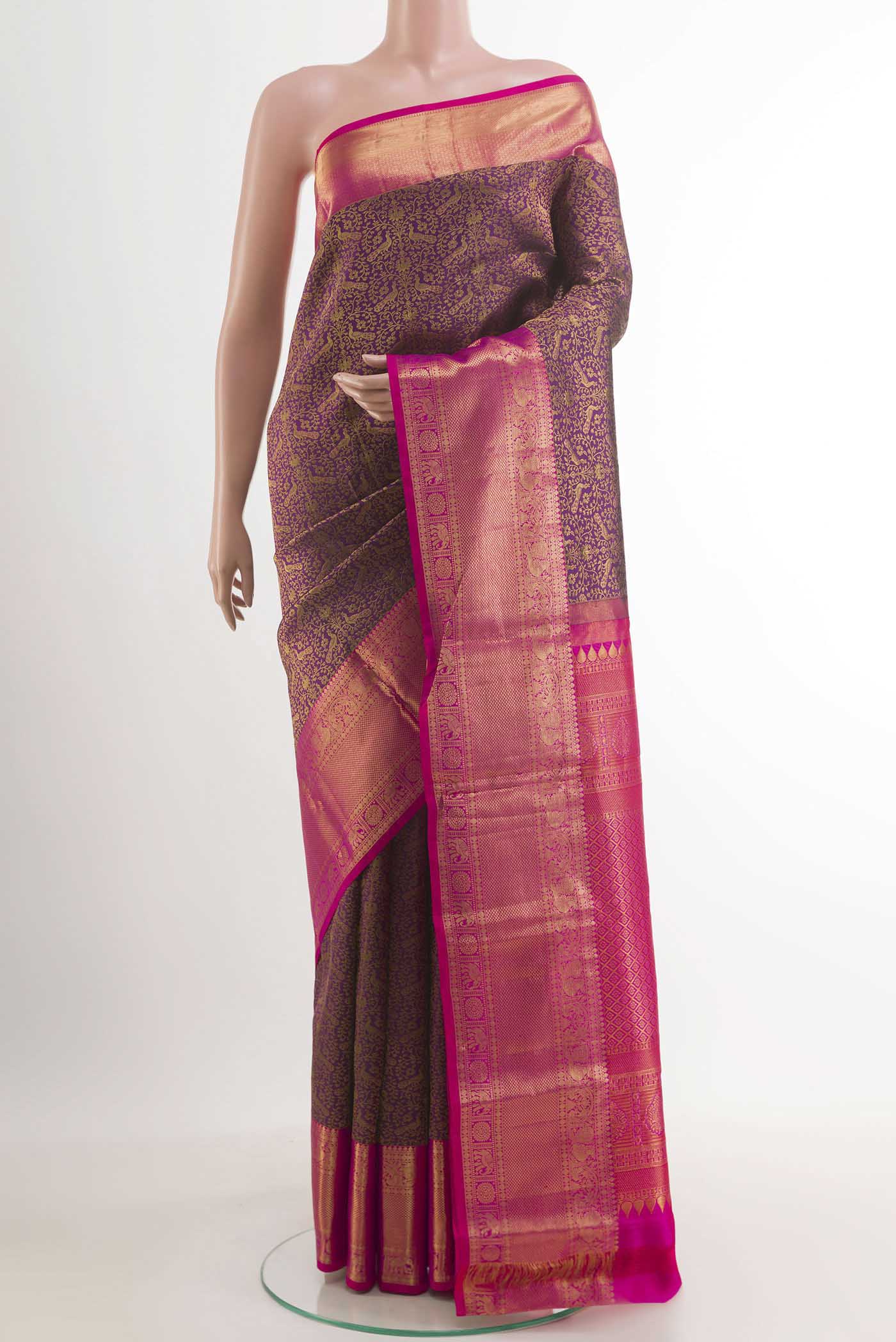 Purple Kanchipuram Silk Saree with Zari Brocade on the body and Zari Border.  displayed on a mannequin