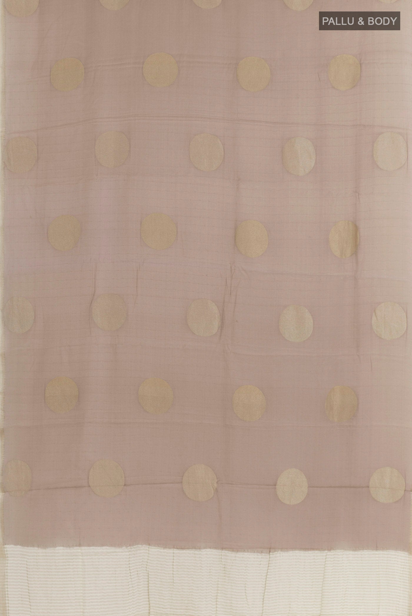 Flat view of Beige Mysore Crepe Saree with Zari Butta on the body and Zari Border. 