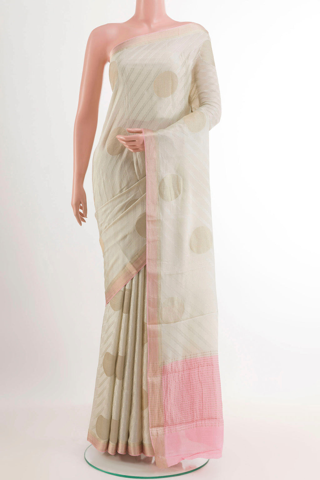 Off White Mysore Crepe Saree with Zari Butta on the body and Zari Border.  displayed on a mannequin