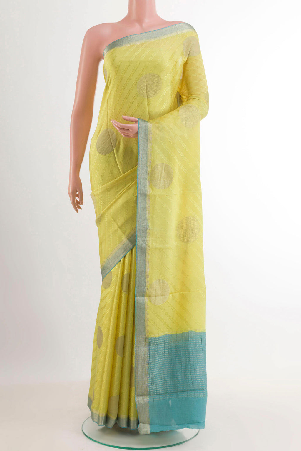 Yellow Mysore Crepe Saree with Zari Butta on the body and Zari Border.  displayed on a mannequin