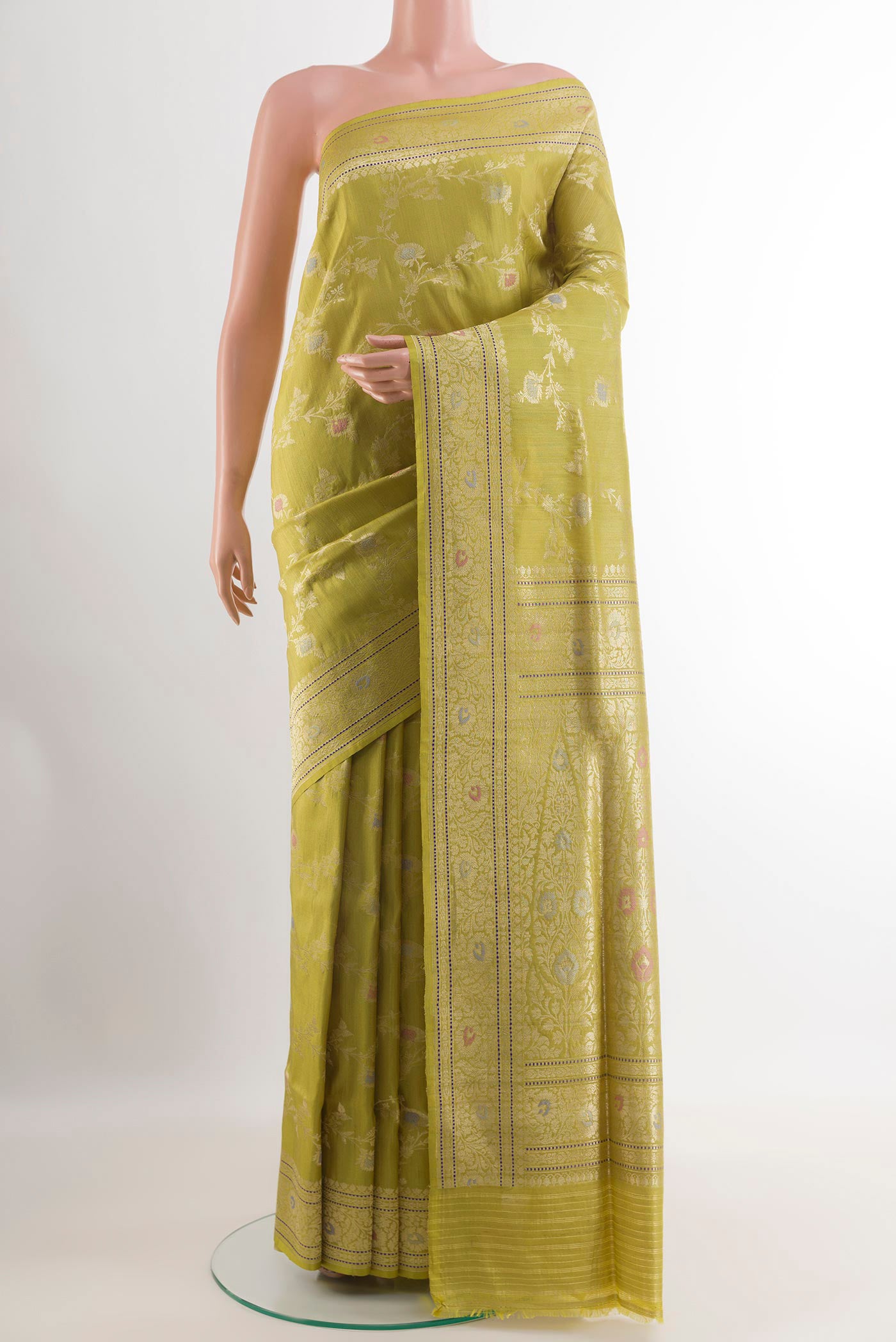 Green Banarasi Tussar Silk Saree with Zari Brocade on the body and Zari Border.  displayed on a mannequin