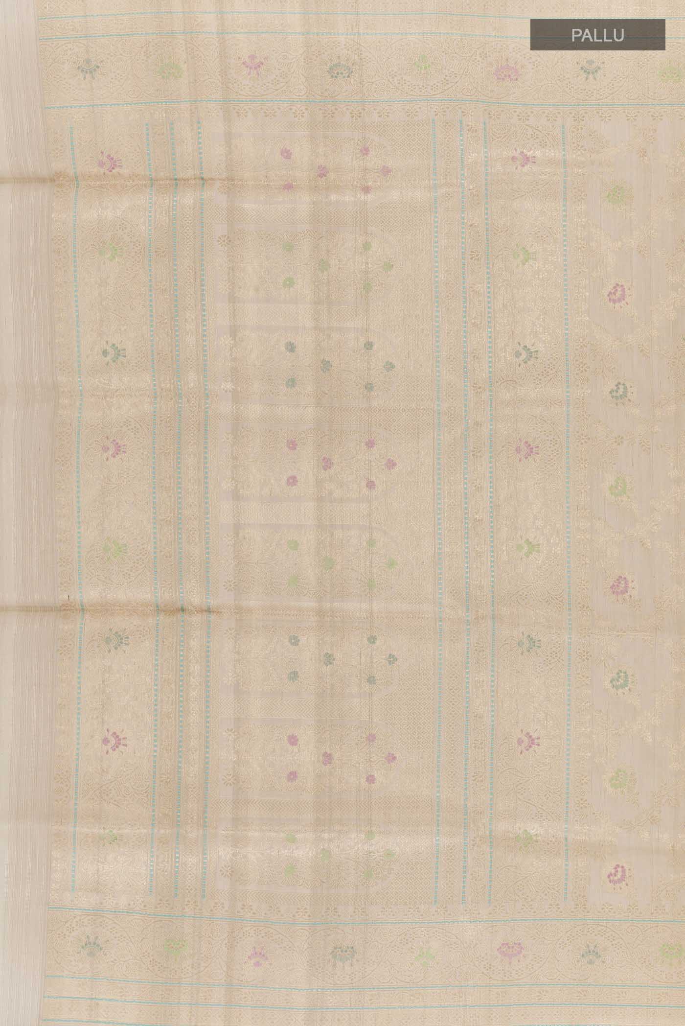 Close up image of the pallu of Off White Banarasi Tussar Silk Saree with Zari Butta on the body and Zari Border. 